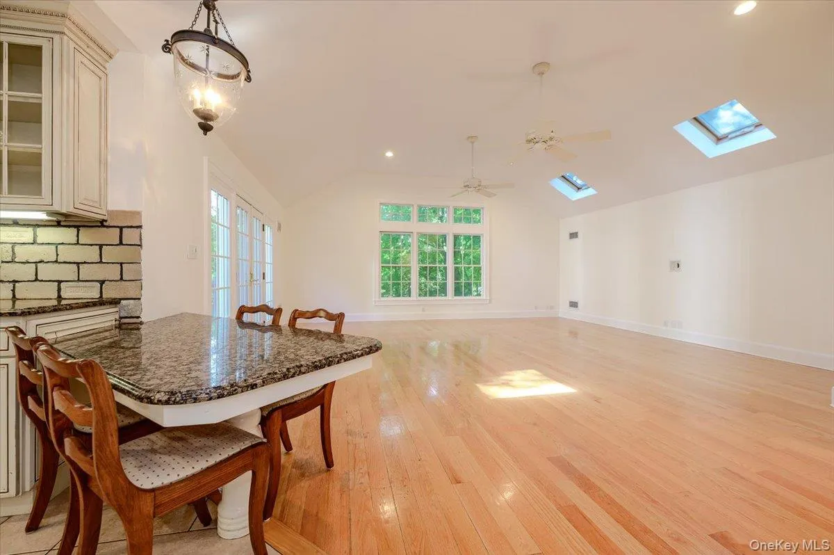 Perfect..family room with high ceilings, light drenched by way of skylights, architectural window and French doors. Perfect..family room with high ceilings, light drenched by way of skylights, architectural window and French doors.