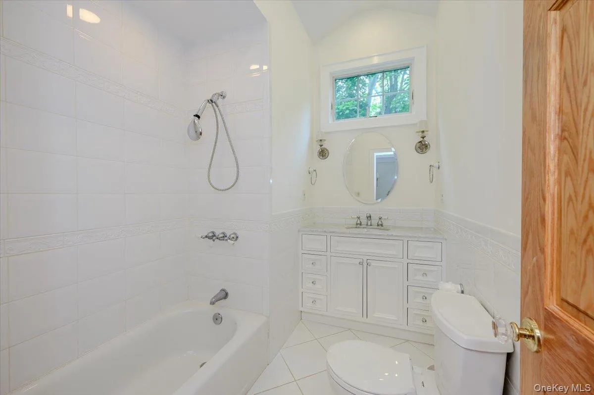 Full hall bath services two additional bedrooms; truly lovely with tile floors, marble vanity, tub/shower Full hall bath services two additional bedrooms; truly lovely with tile floors, marble vanity, tub/shower