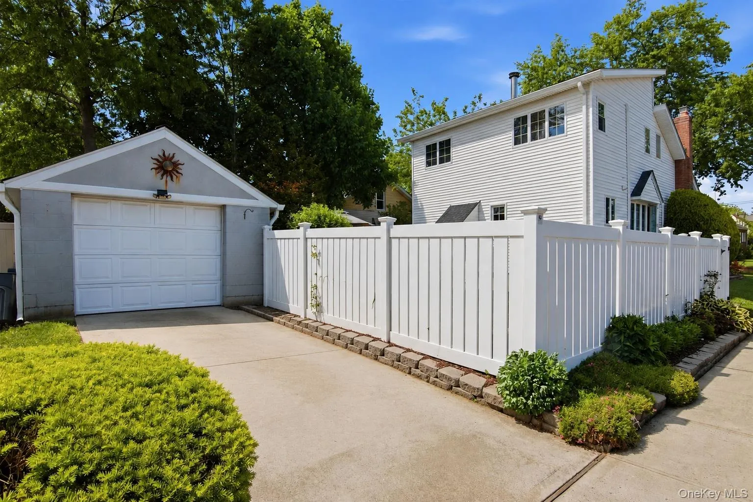 Fenced backyard. Garage with long driveway that leads into the house from the side. Fenced backyard. Garage with long driveway that leads into the house from the side.