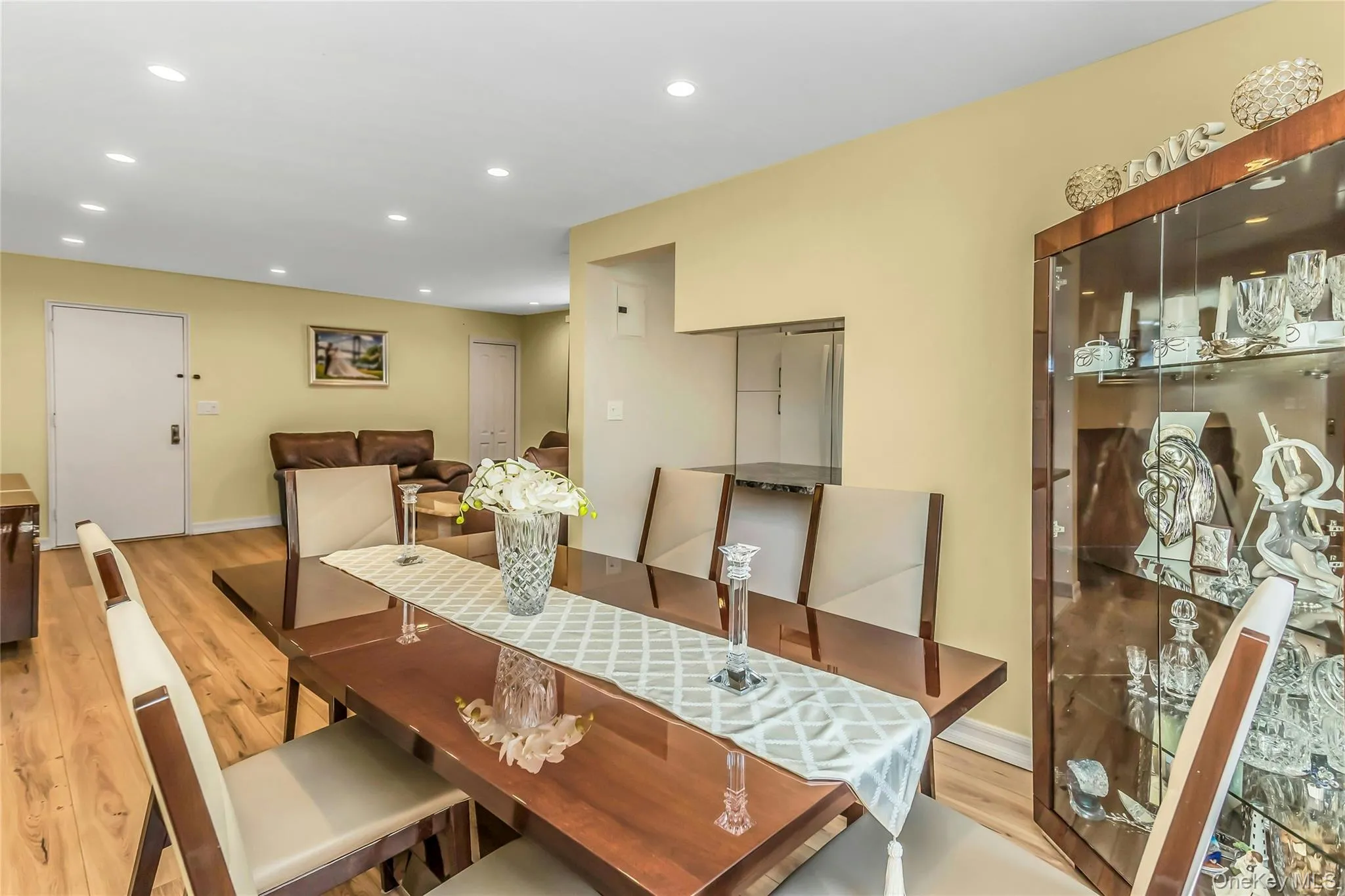 Dining area featuring wood-finish flooring and recessed lighting Dining area featuring wood-finish flooring and recessed lighting