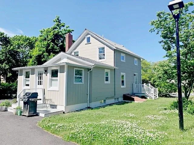 Rear entrance with grill and side yard Rear entrance with grill and side yard