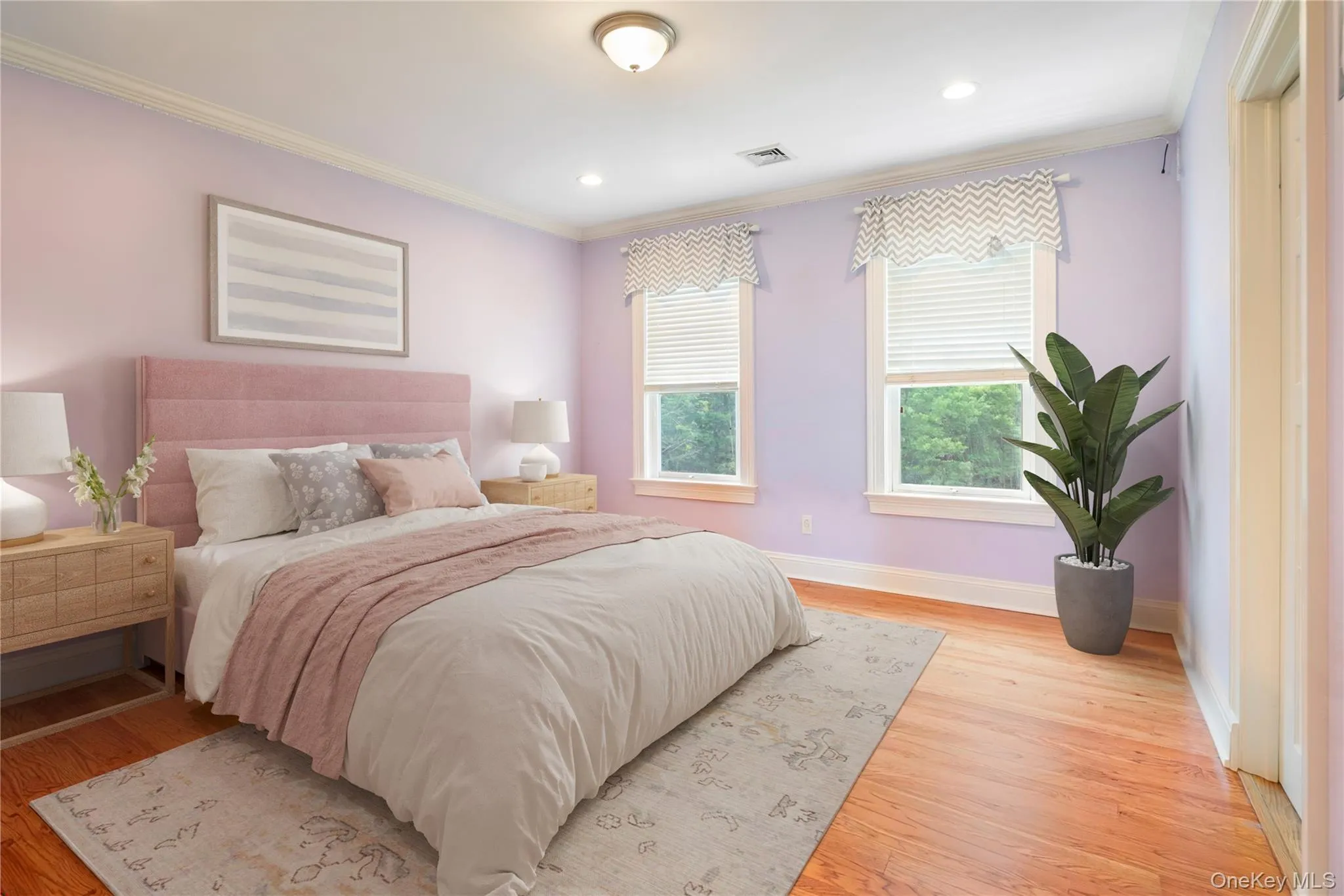 Bedroom 3 with oak floors, walk-in closet, crown molding and recessed lighting (virtually staged) Bedroom 3 with oak floors, walk-in closet, crown molding and recessed lighting (virtually staged)