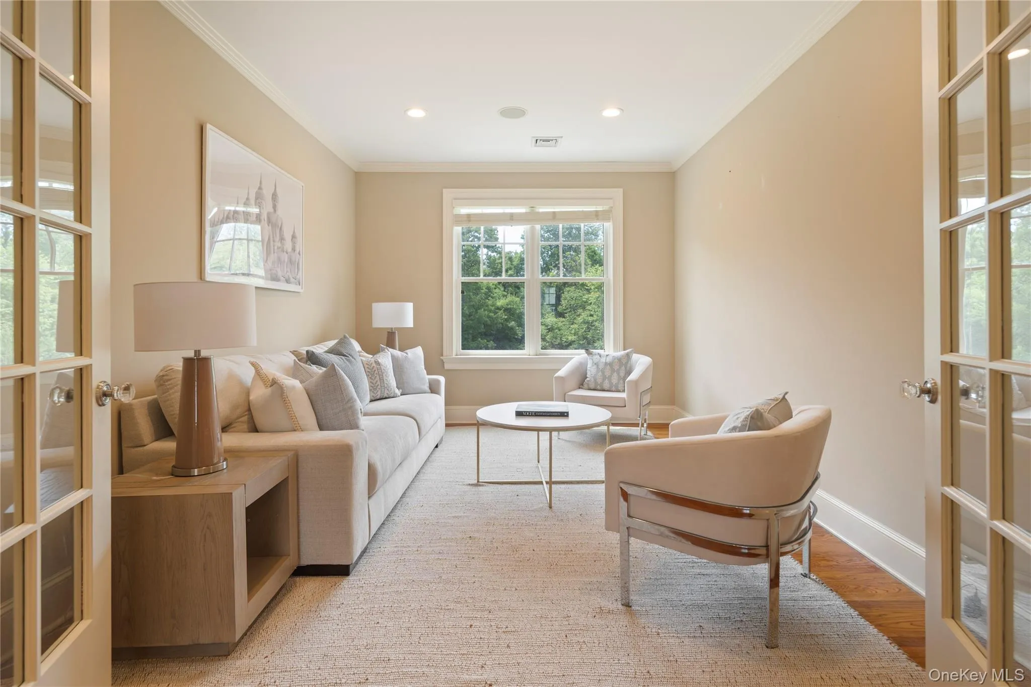 French doors to sitting room/home office directly off of primary bedroom, crown molding, recessed lighting, oak floors French doors to sitting room/home office directly off of primary bedroom, crown molding, recessed lighting, oak floors