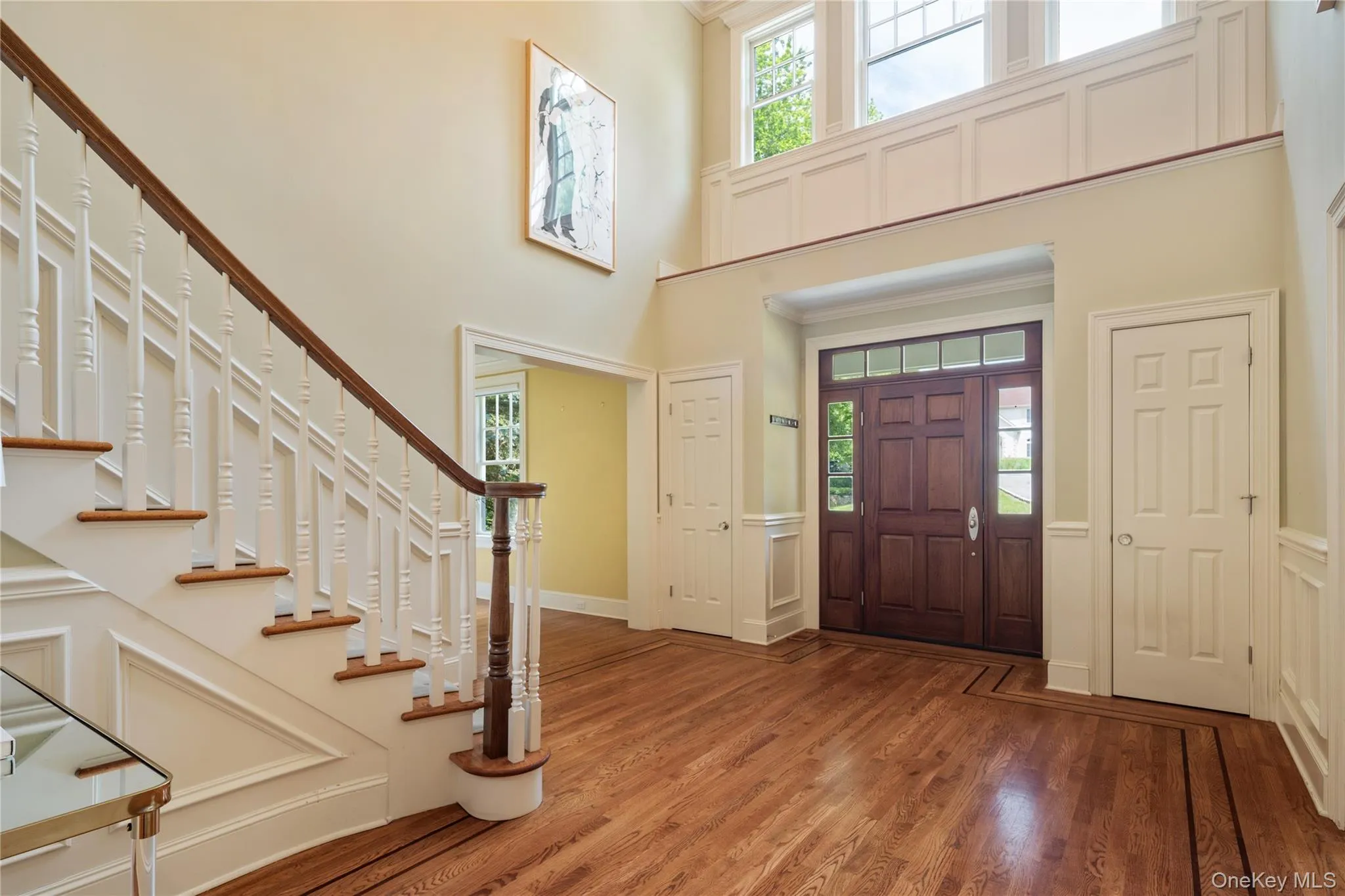 Clerestory windows above provide ample light , entry door with transom windows above and sidelights Clerestory windows above provide ample light , entry door with transom windows above and sidelights