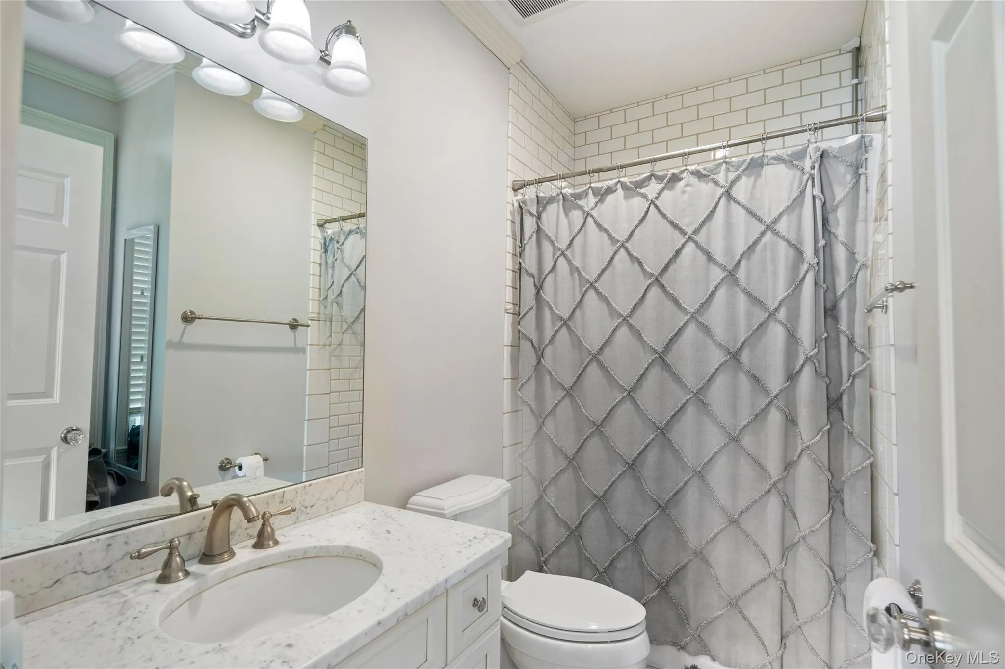 En-suite full bathroom in bedroom 3, Carrera marble and subway tile, full tub En-suite full bathroom in bedroom 3, Carrera marble and subway tile, full tub