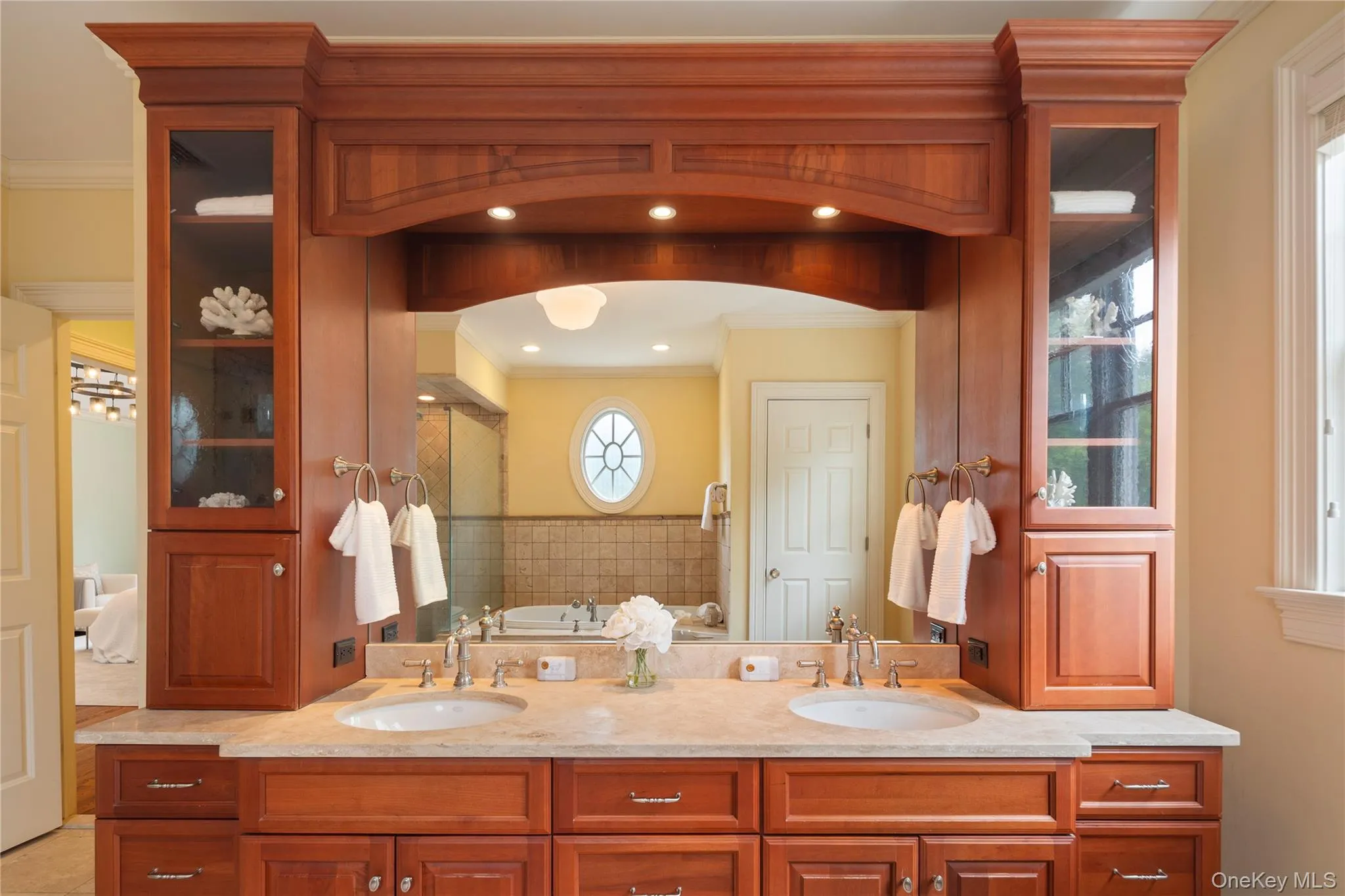 Primary bath vanity with dual sinks and storage towers Primary bath vanity with dual sinks and storage towers