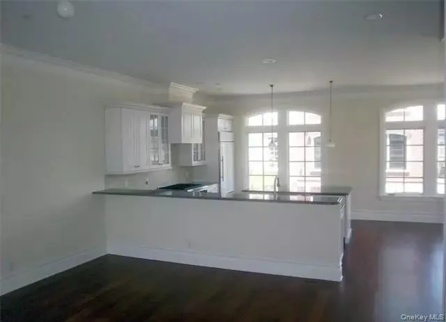 Eat in kitchen with long bar counter facing the dining area & living room... just add your bar stools... Eat in kitchen with long bar counter facing the dining area & living room... just add your bar stools...