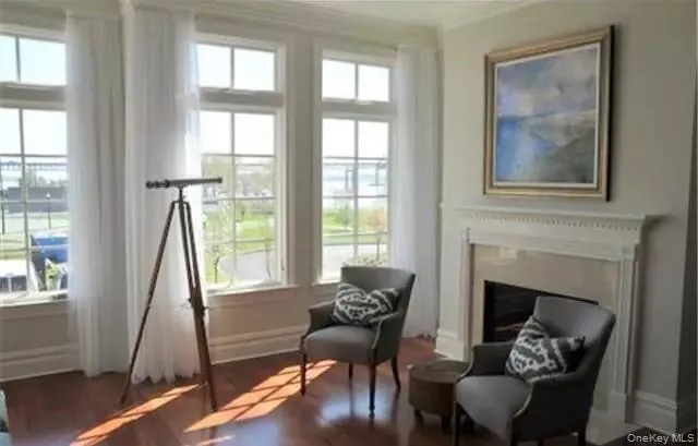 Living room with high ceilings & Marble fireplace... gleaming Mahogany hardwood floors throughout... Living room with high ceilings & Marble fireplace... gleaming Mahogany hardwood floors throughout...