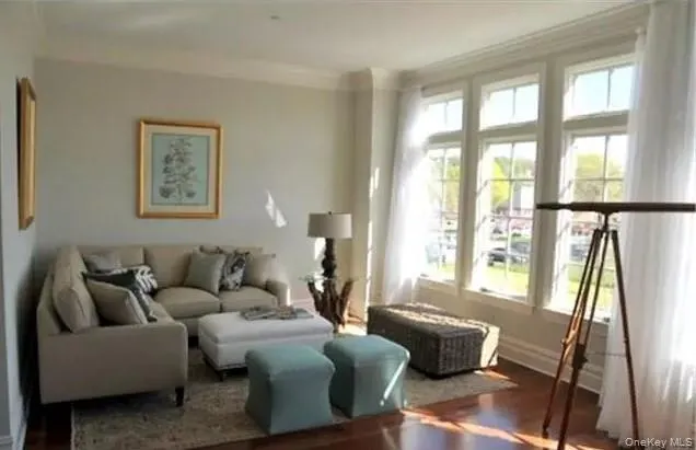 Entry hall with powder room opens up to generous living room... over sized windows make it light & bright... Entry hall with powder room opens up to generous living room... over sized windows make it light & bright...