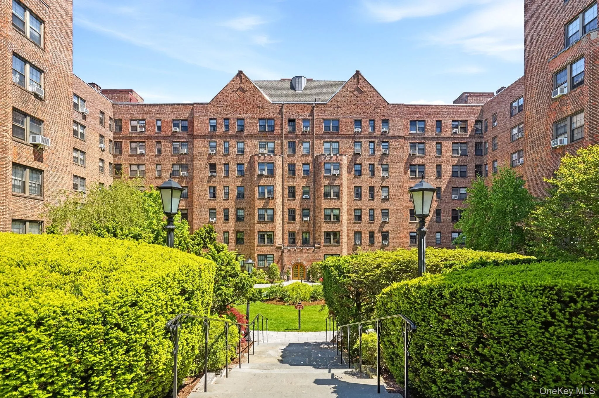 Beautifully landscaped courtyard entrance leading into this charming and meticulously maintained building. Beautifully landscaped courtyard entrance leading into this charming and meticulously maintained building.