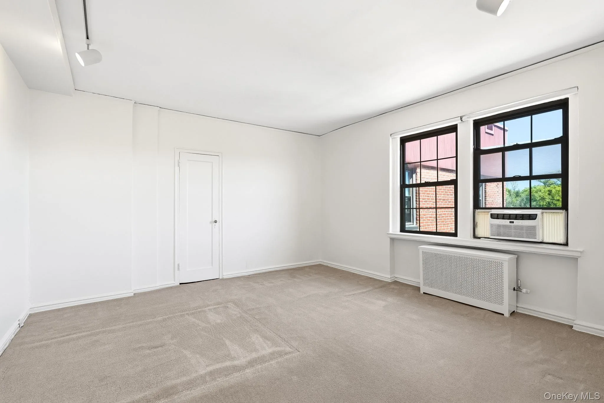 Large and spacious bedroom with enough room to comfortably fit a king-size bed. Large and spacious bedroom with enough room to comfortably fit a king-size bed.