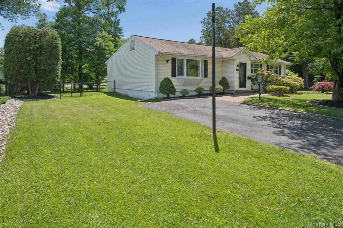 Crisp siding, classic black shutters, professional landscaping, and expansive driveway, this property is a turnkey masterpiece waiting for its next chapter. Crisp siding, classic black shutters, professional landscaping, and expansive driveway, this property is a turnkey masterpiece waiting for its next chapter.