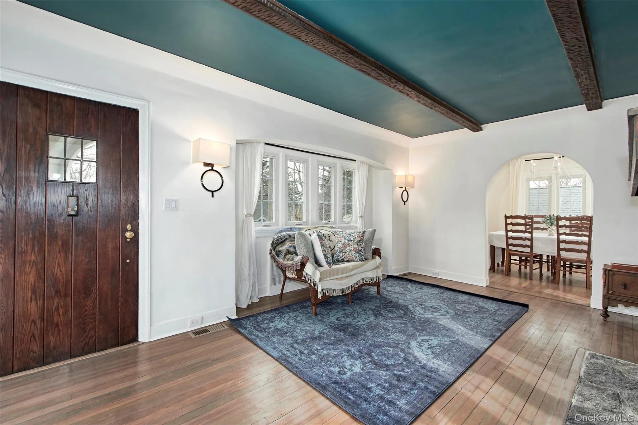 Foyer entrance with beamed ceiling and hardwood / wood-style floors Foyer entrance with beamed ceiling and hardwood / wood-style floors