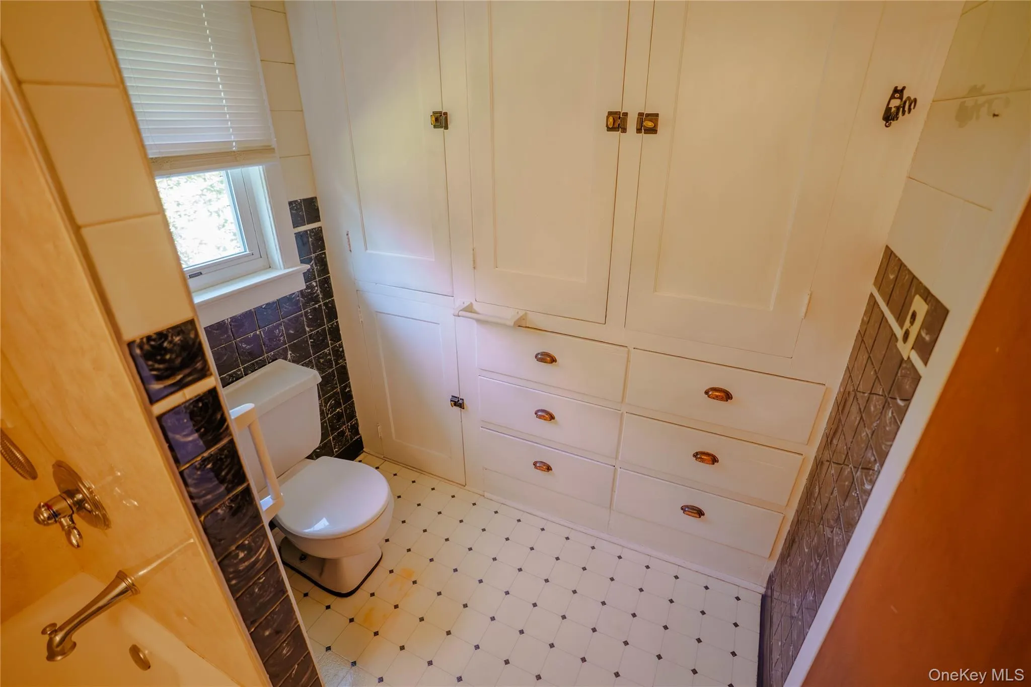 Built-in storage cabinetry with drawers and upper cabinets Built-in storage cabinetry with drawers and upper cabinets
