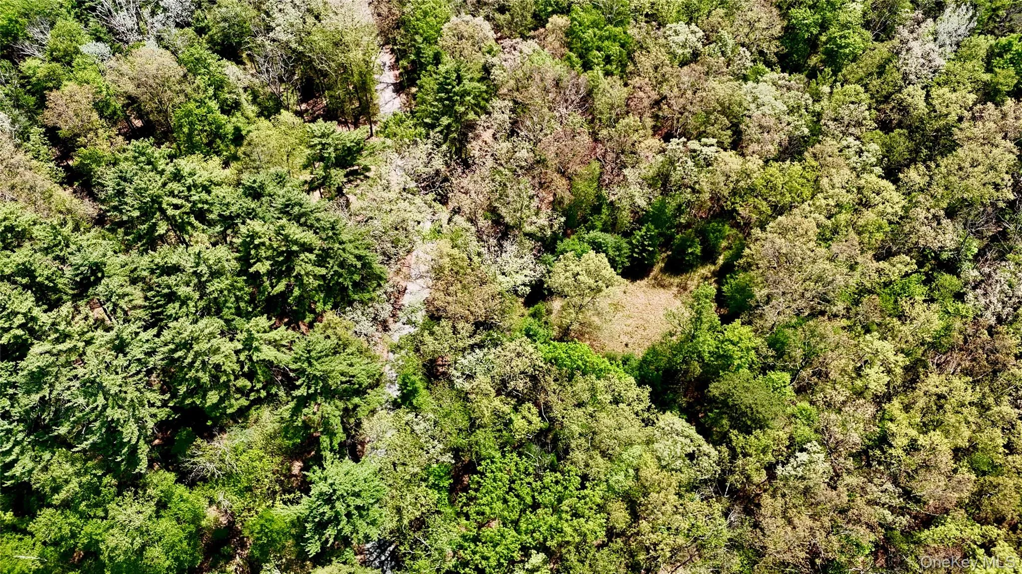 Aerial pictures. Property located to the right of the road, where opening in trees is. Aerial pictures. Property located to the right of the road, where opening in trees is.