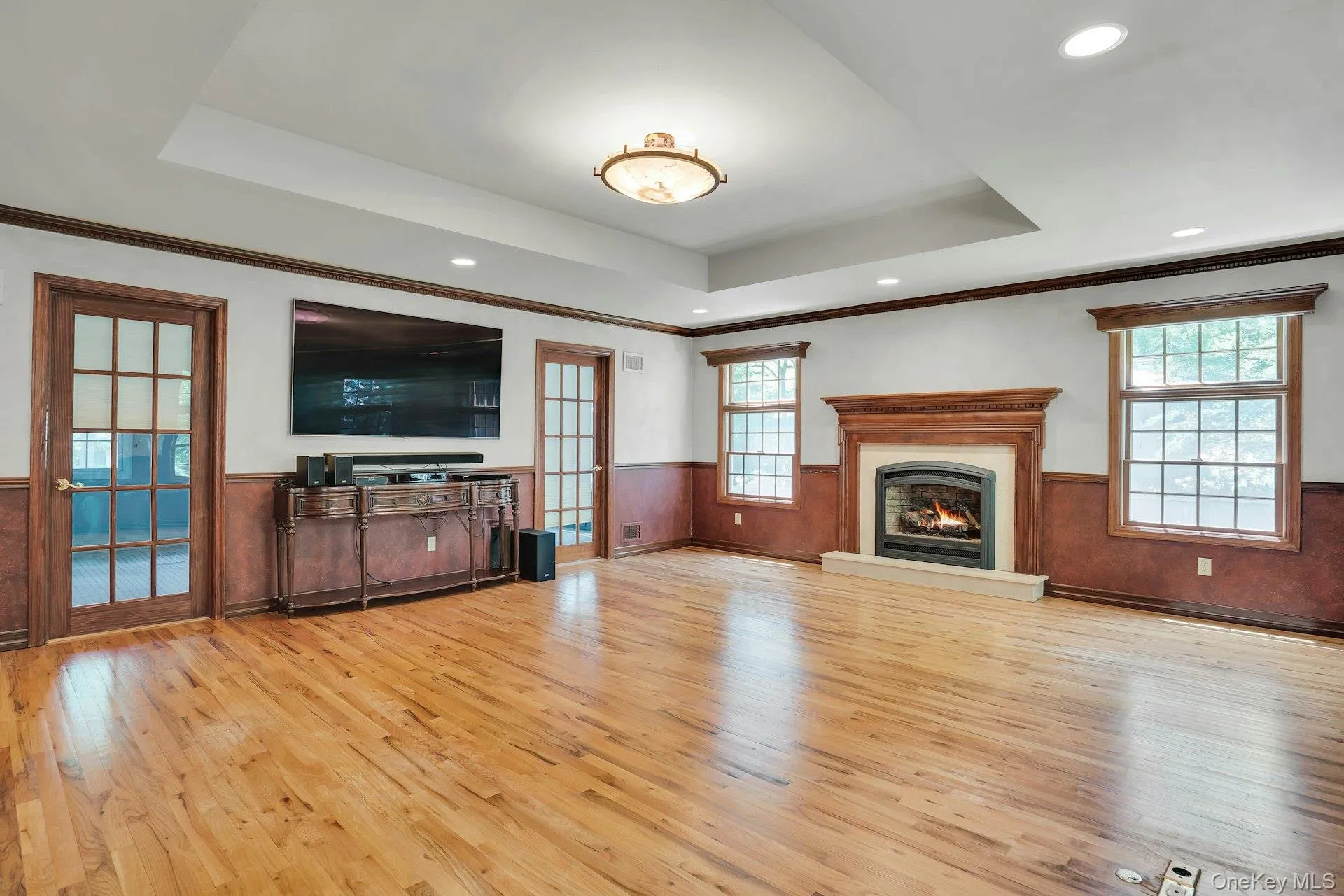 Huge room with trayed ceilings and hardwood floors. Huge room with trayed ceilings and hardwood floors.