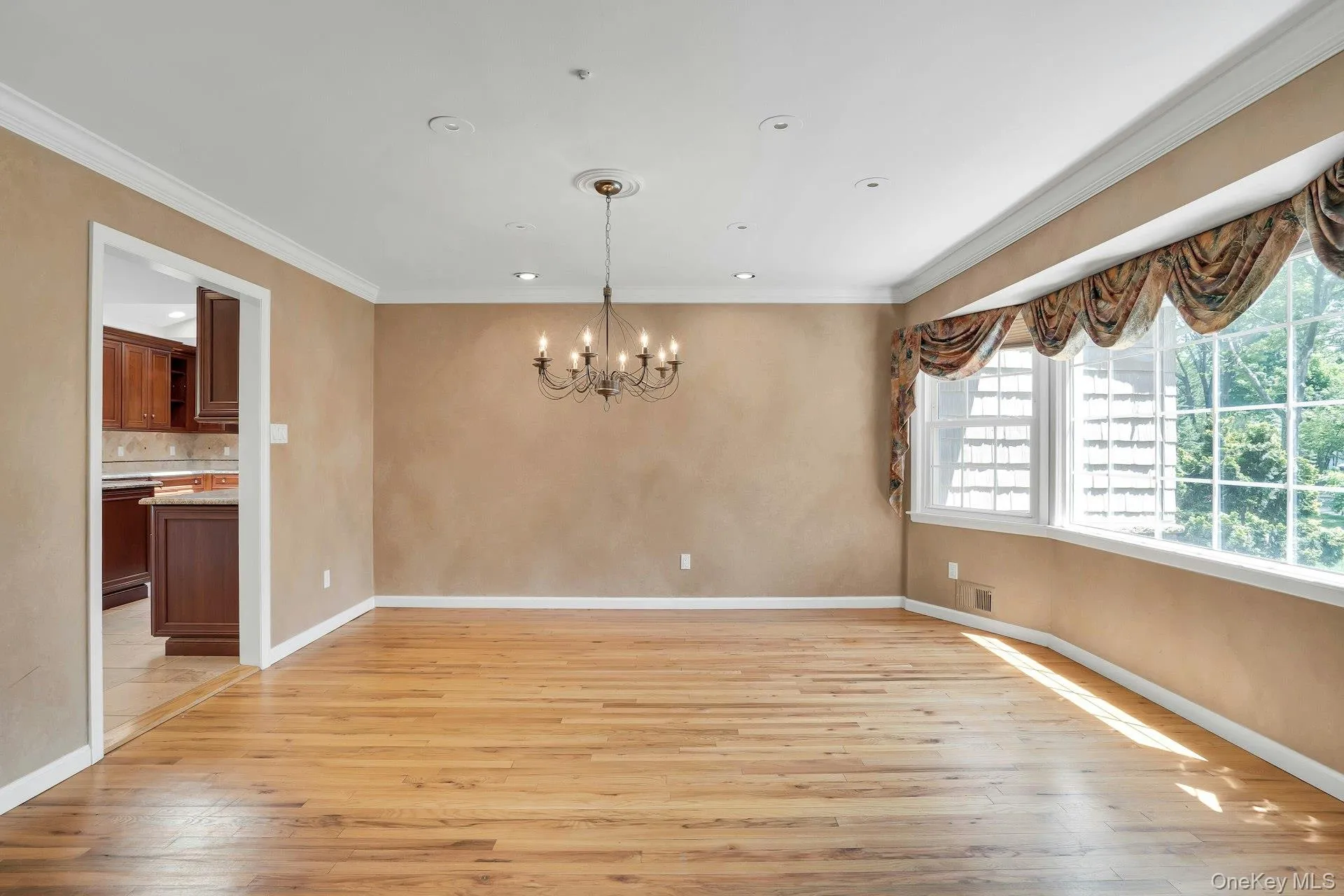 Formal Dining Room with Hardwood Floors and Wall of Windows. Formal Dining Room with Hardwood Floors and Wall of Windows.