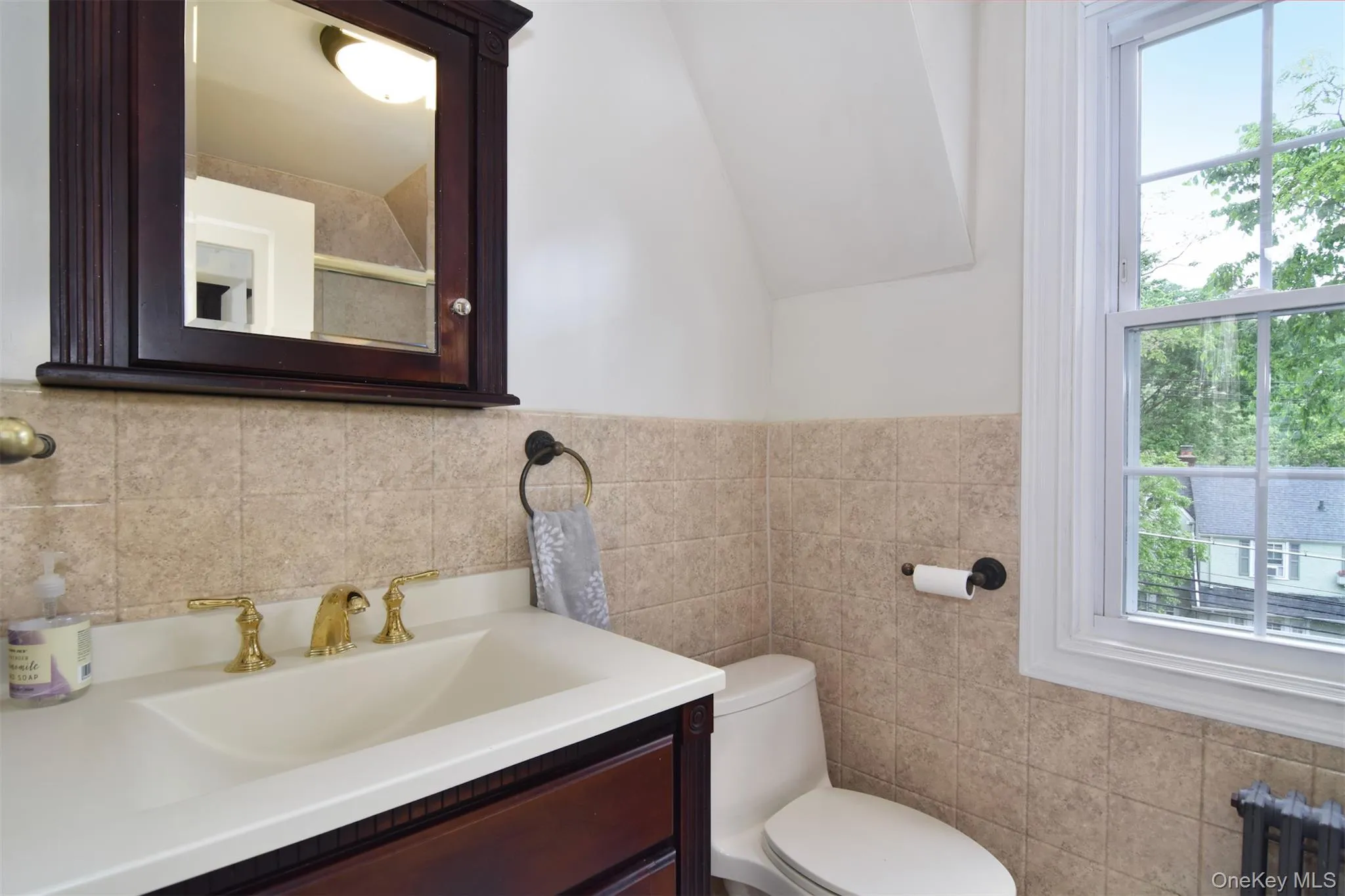 Updated hall bath with tub/shower and sliding glass doors Updated hall bath with tub/shower and sliding glass doors