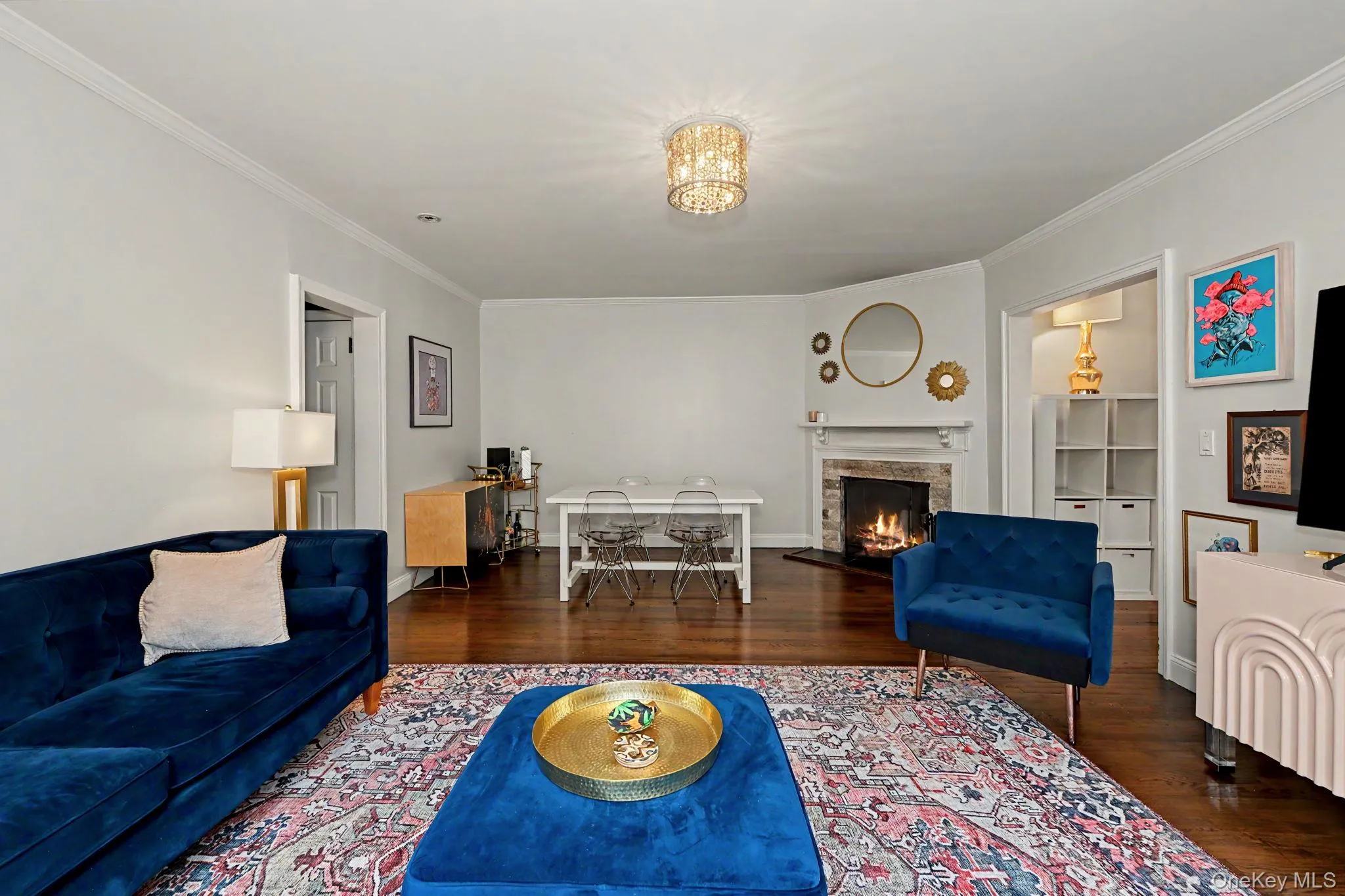 Living room with a dining area and fireplace Living room with a dining area and fireplace