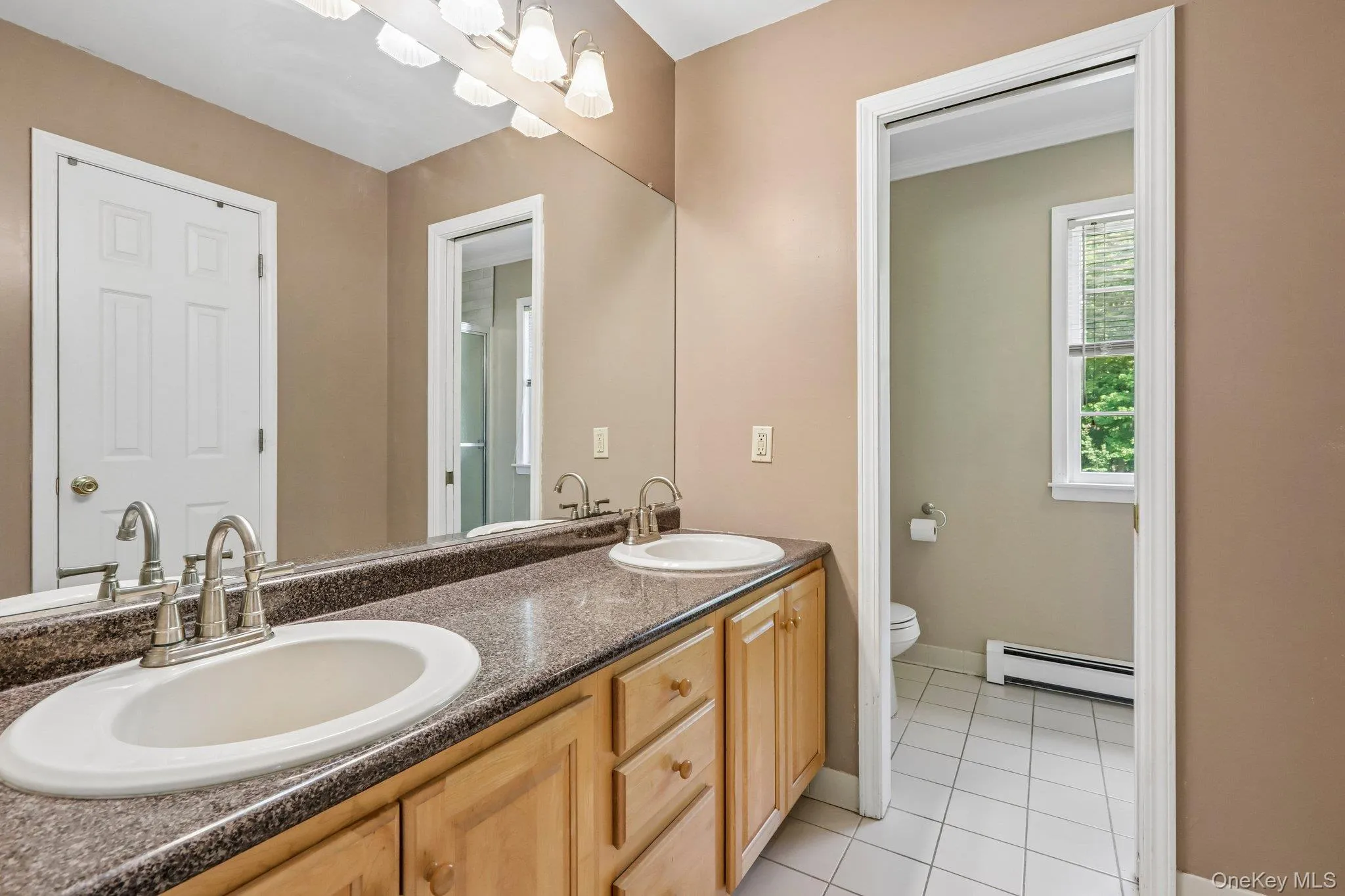 Primary bath with dual sinks. Primary bath with dual sinks.