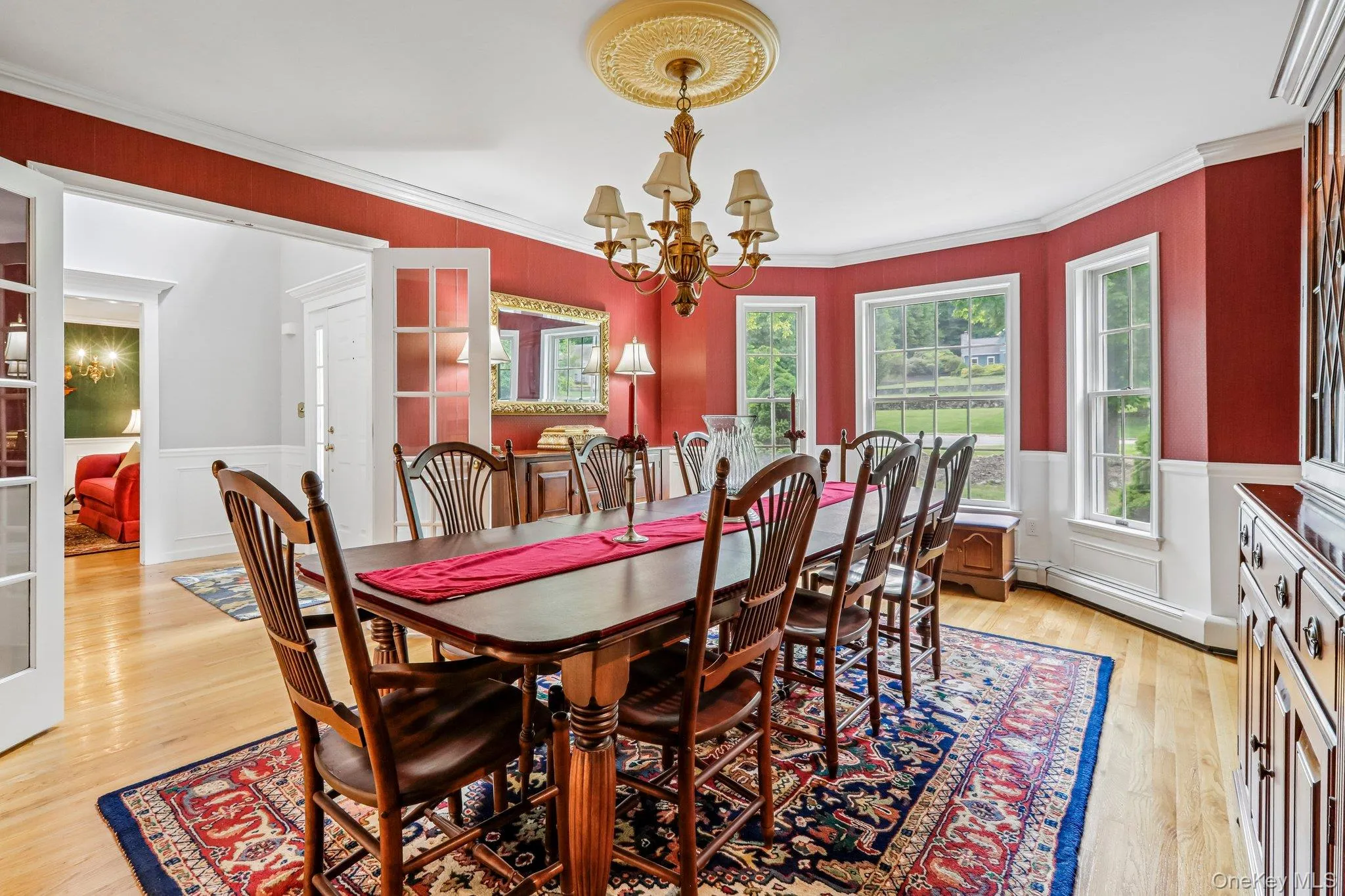 Large formal dining room with crown molding and wainscotting. Large formal dining room with crown molding and wainscotting.