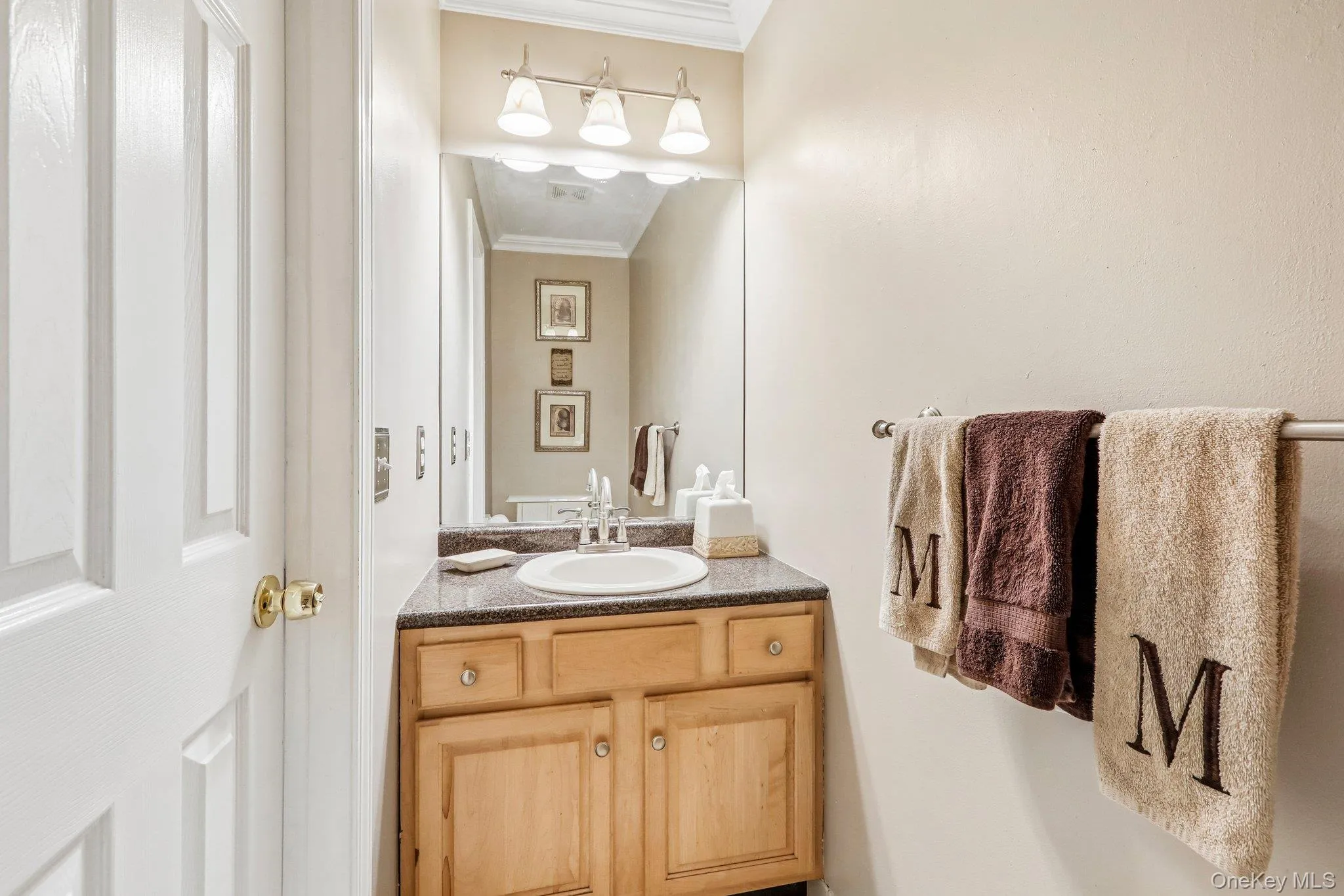 Half bath just off the kitchen. Half bath just off the kitchen.