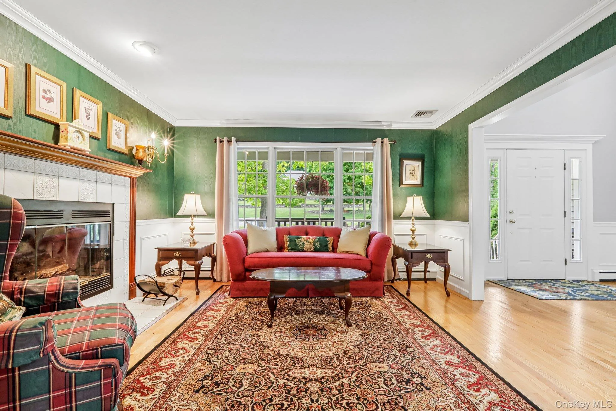 Gleaming hardwood floors and cozy fireplace. Gleaming hardwood floors and cozy fireplace.