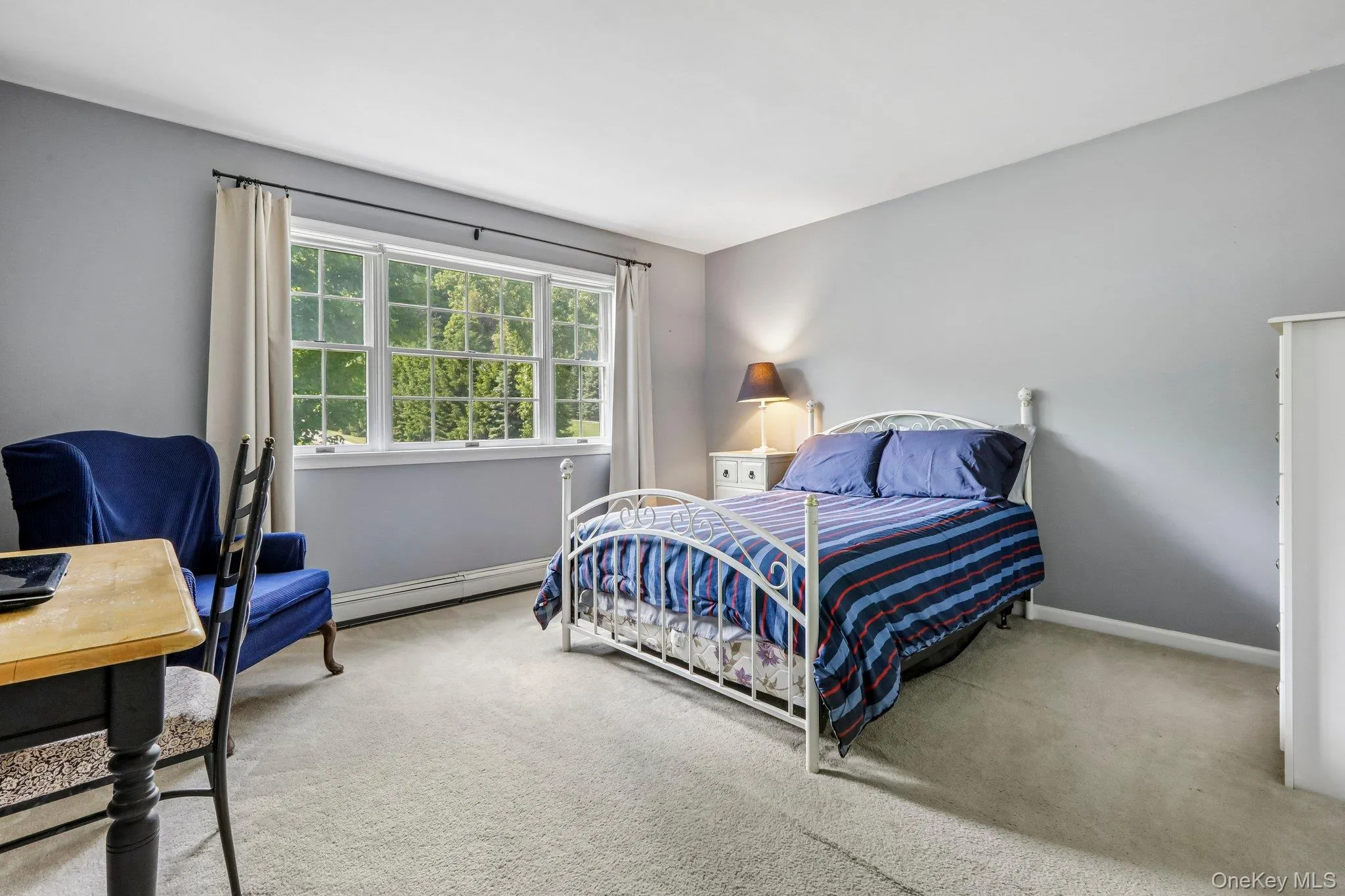 Large carpeted bedroom. Large carpeted bedroom.
