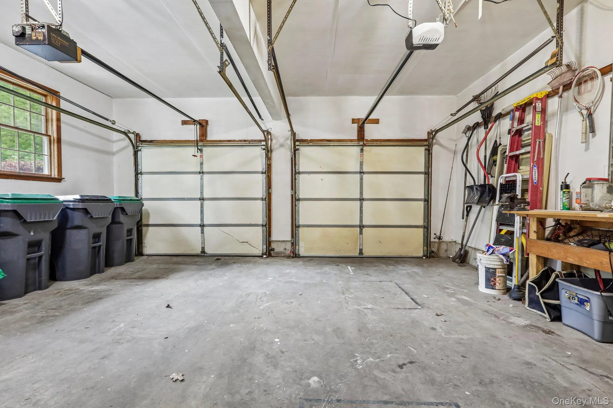 Lots of room in the 2 car garage with openers. Lots of room in the 2 car garage with openers.