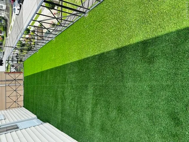 Large balcony from living room with grass outdoor rug Large balcony from living room with grass outdoor rug