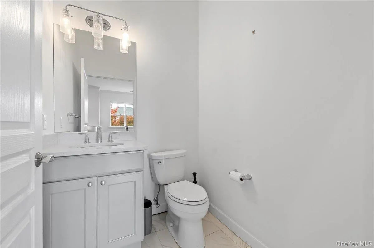 Bathroom featuring vanity and light tile patterned floors Bathroom featuring vanity and light tile patterned floors