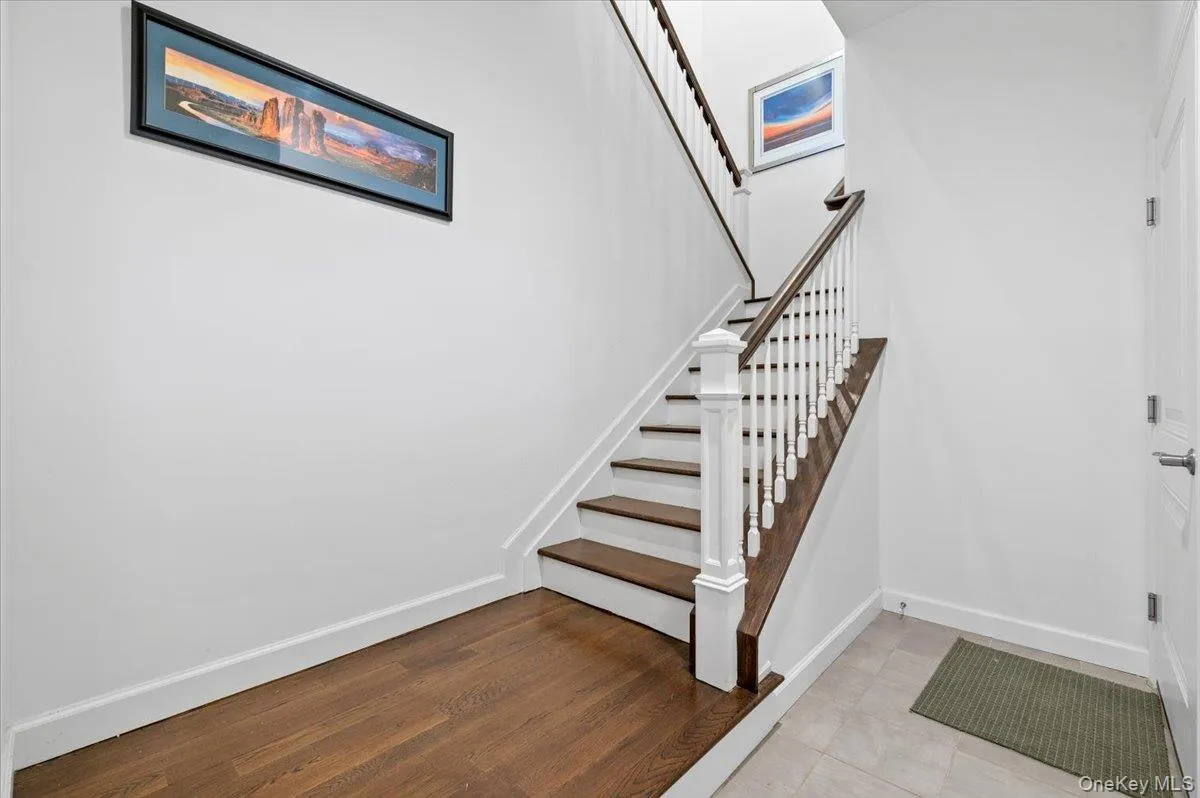 Stairway with baseboards andwood finished floors Stairway with baseboards andwood finished floors