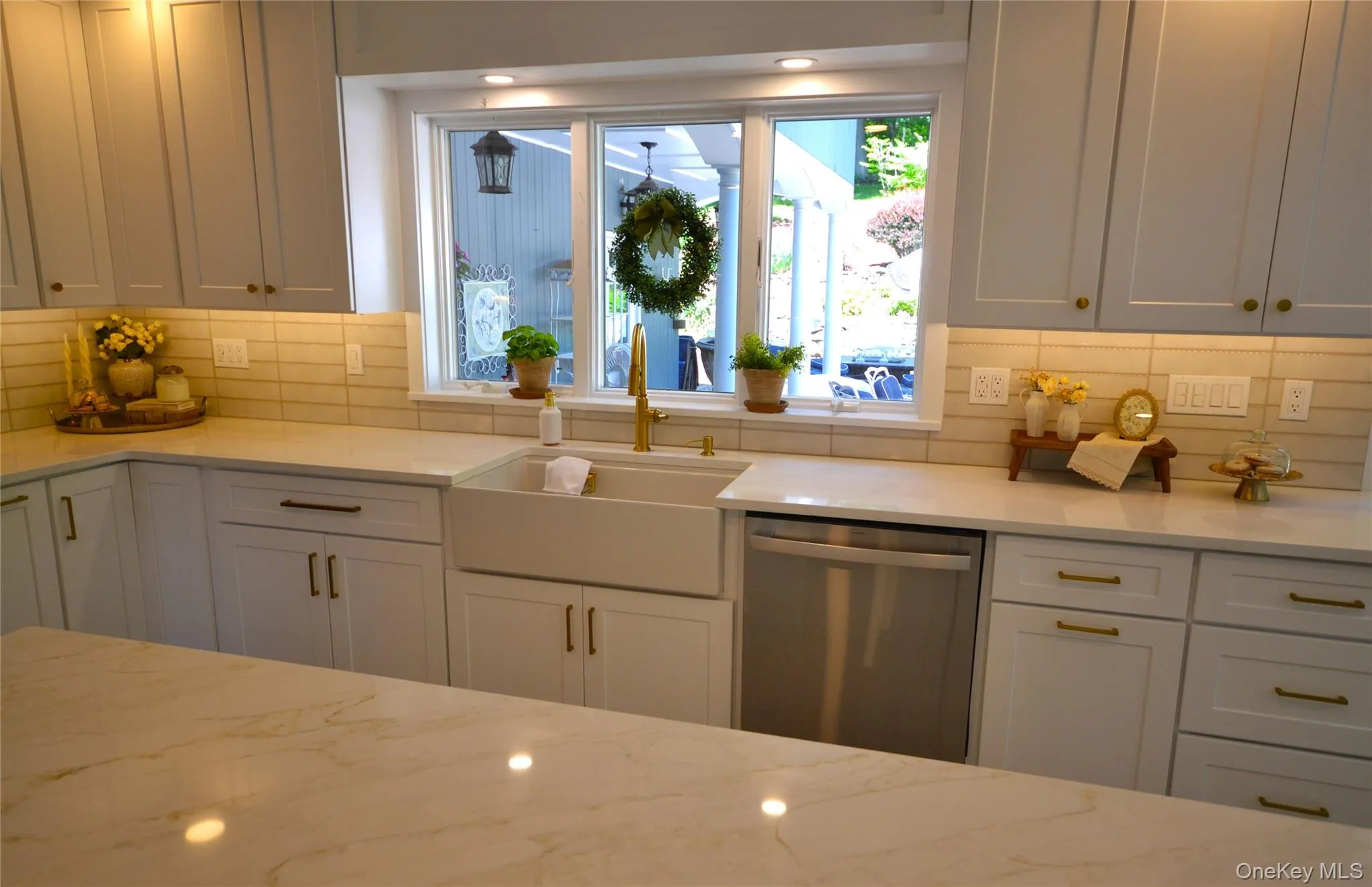 Country sink with view of magical back yard space.. Country sink with view of magical back yard space..