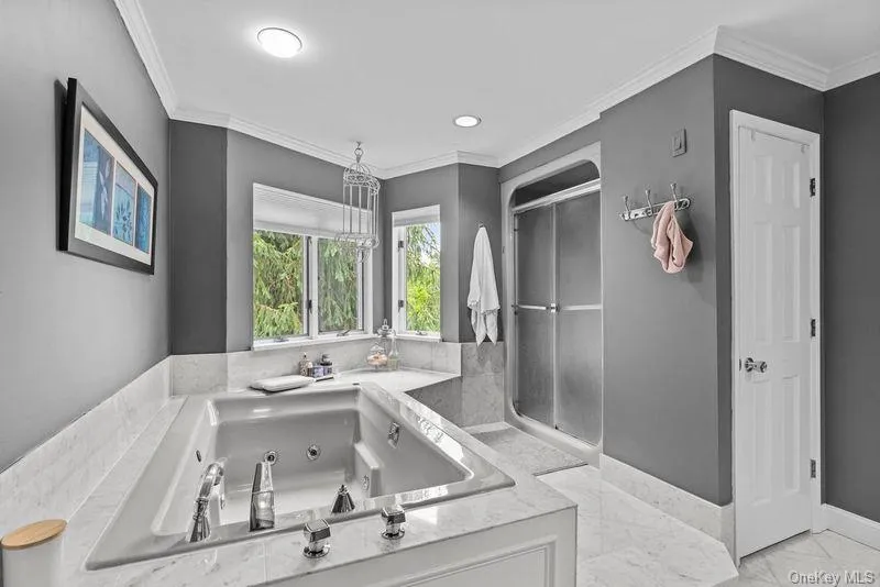 Stand up shower in Primary bathroom and marble floors. Stand up shower in Primary bathroom and marble floors.