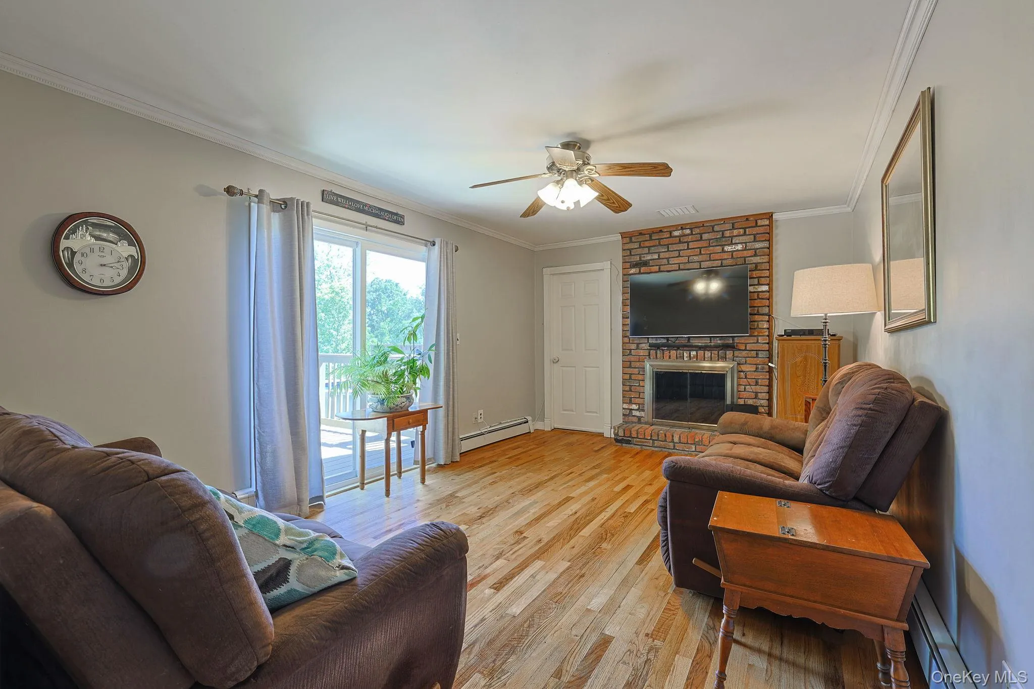 There's a fireplace in the den. To your left are sliding doors to the above ground pool and deck. There's a fireplace in the den. To your left are sliding doors to the above ground pool and deck.