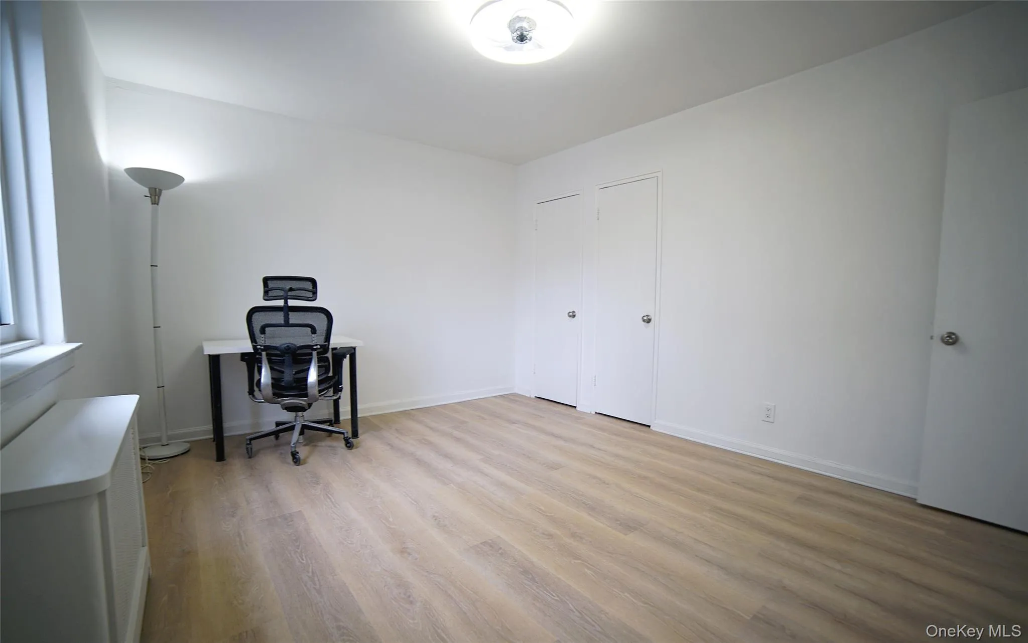 Office featuring baseboards and light wood-type flooring Office featuring baseboards and light wood-type flooring