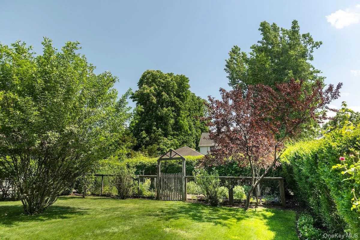 Back yard with fenced-in protected vegetable garden Back yard with fenced-in protected vegetable garden