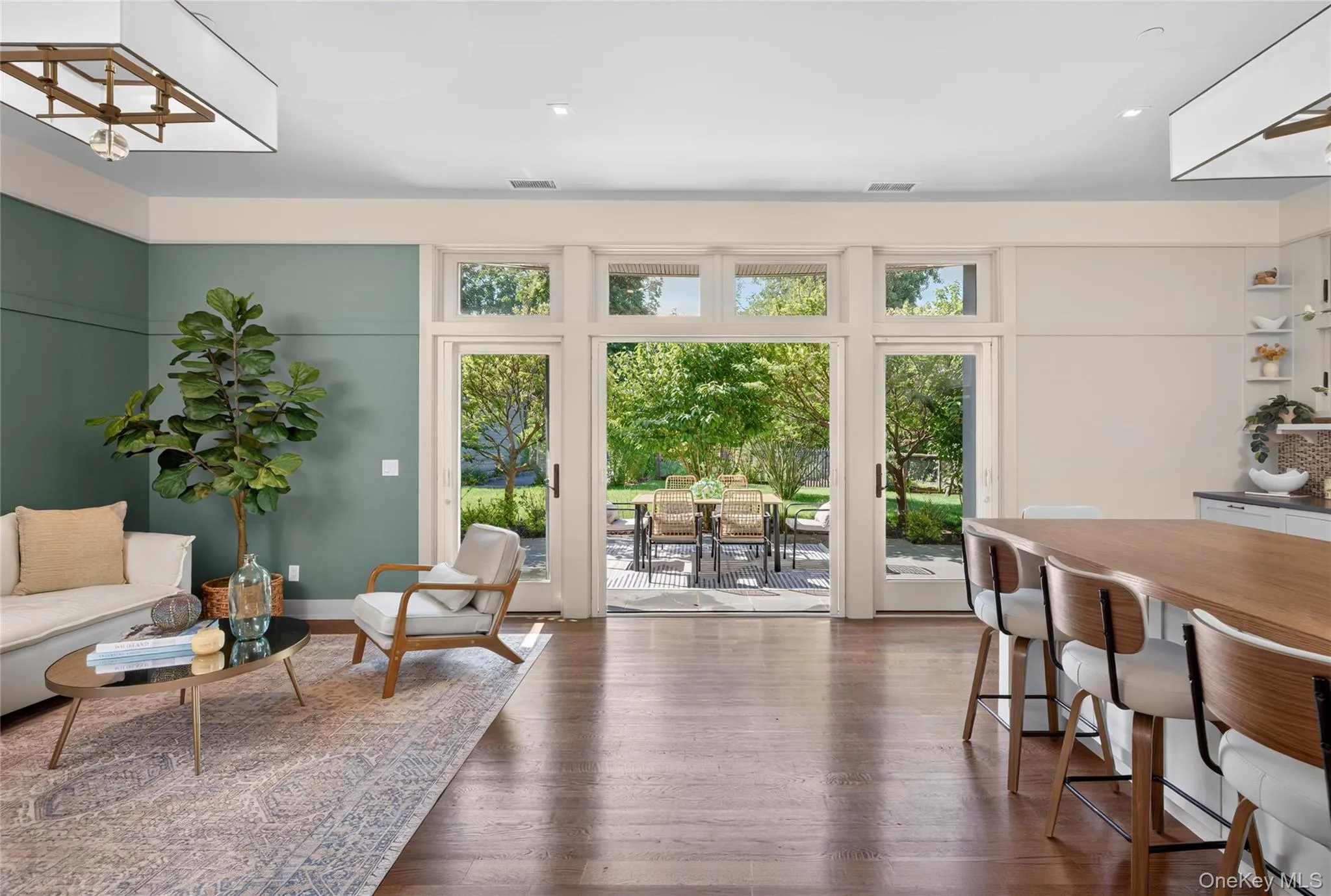 Stunning great room with living and kitchen space, both leading to patio Stunning great room with living and kitchen space, both leading to patio