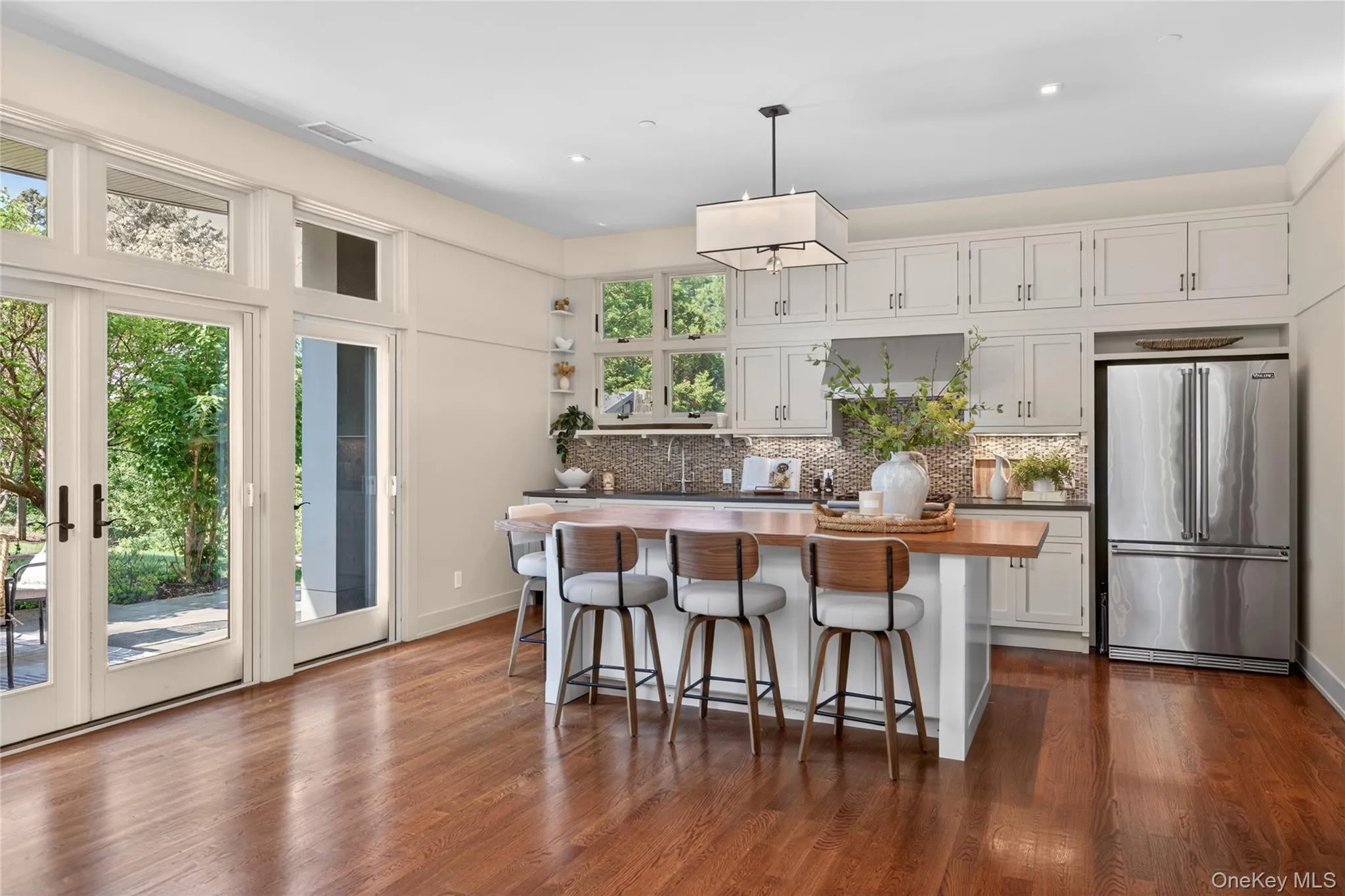 8.5 ft custom-designed oak-topped island with ample storage 8.5 ft custom-designed oak-topped island with ample storage