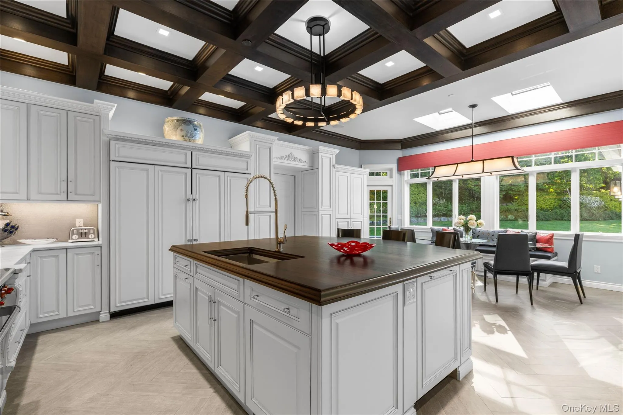 Renovated eat in kitchen with dramatic coffered ceilings and butler's pantry with prep area Renovated eat in kitchen with dramatic coffered ceilings and butler's pantry with prep area