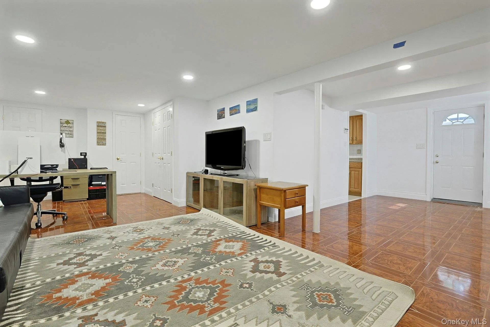 Spacious room featuring glossy tile flooring, recessed lighting, and white walls Spacious room featuring glossy tile flooring, recessed lighting, and white walls