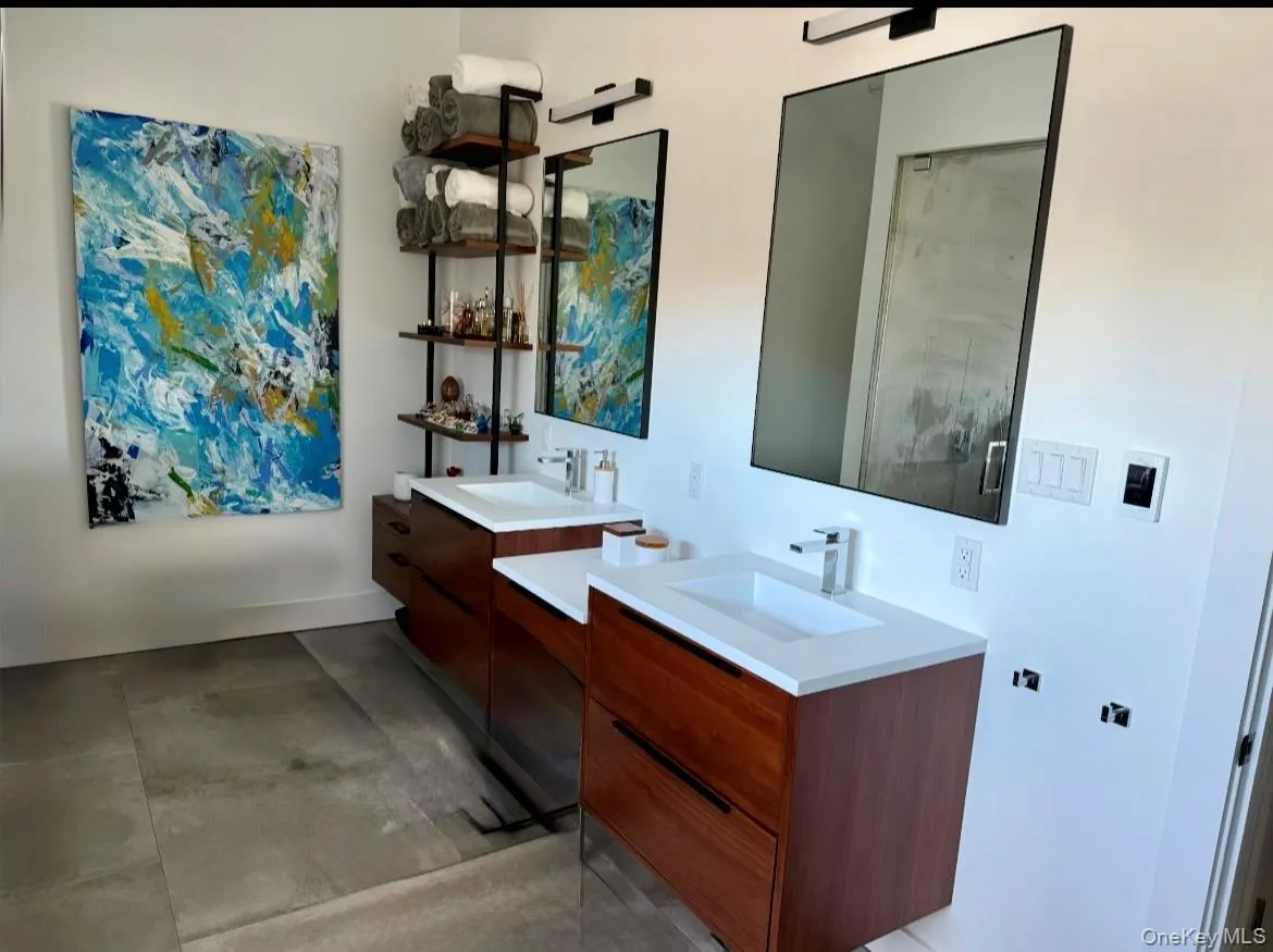Full bathroom featuring two vanities Full bathroom featuring two vanities