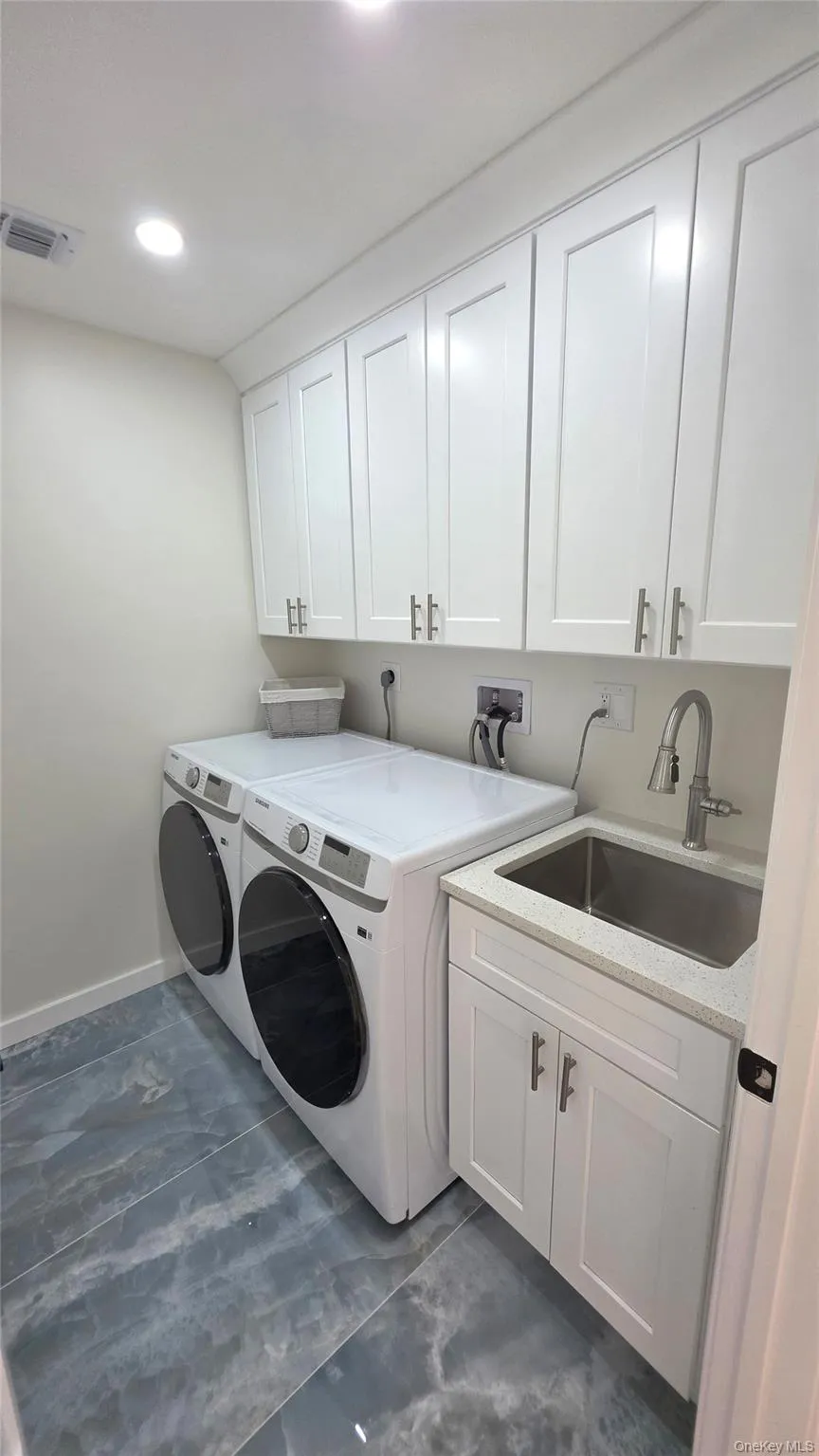 Spacious Laundry Room on 2nd floor with sink and cabinets for convenience and plenty of storage! Spacious Laundry Room on 2nd floor with sink and cabinets for convenience and plenty of storage!