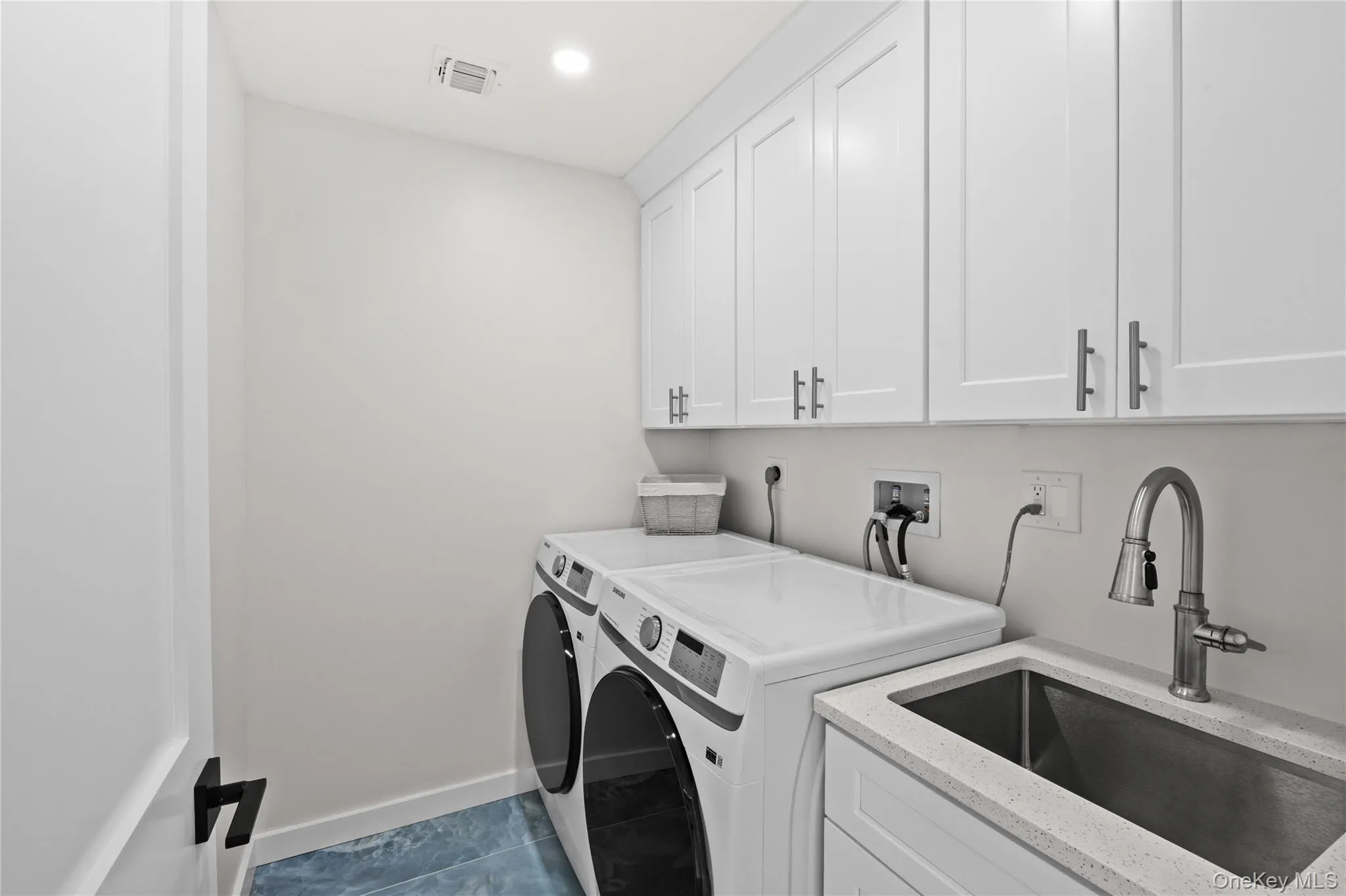 2nd floor laundry room equipped with additional sink and plenty of storage! 2nd floor laundry room equipped with additional sink and plenty of storage!