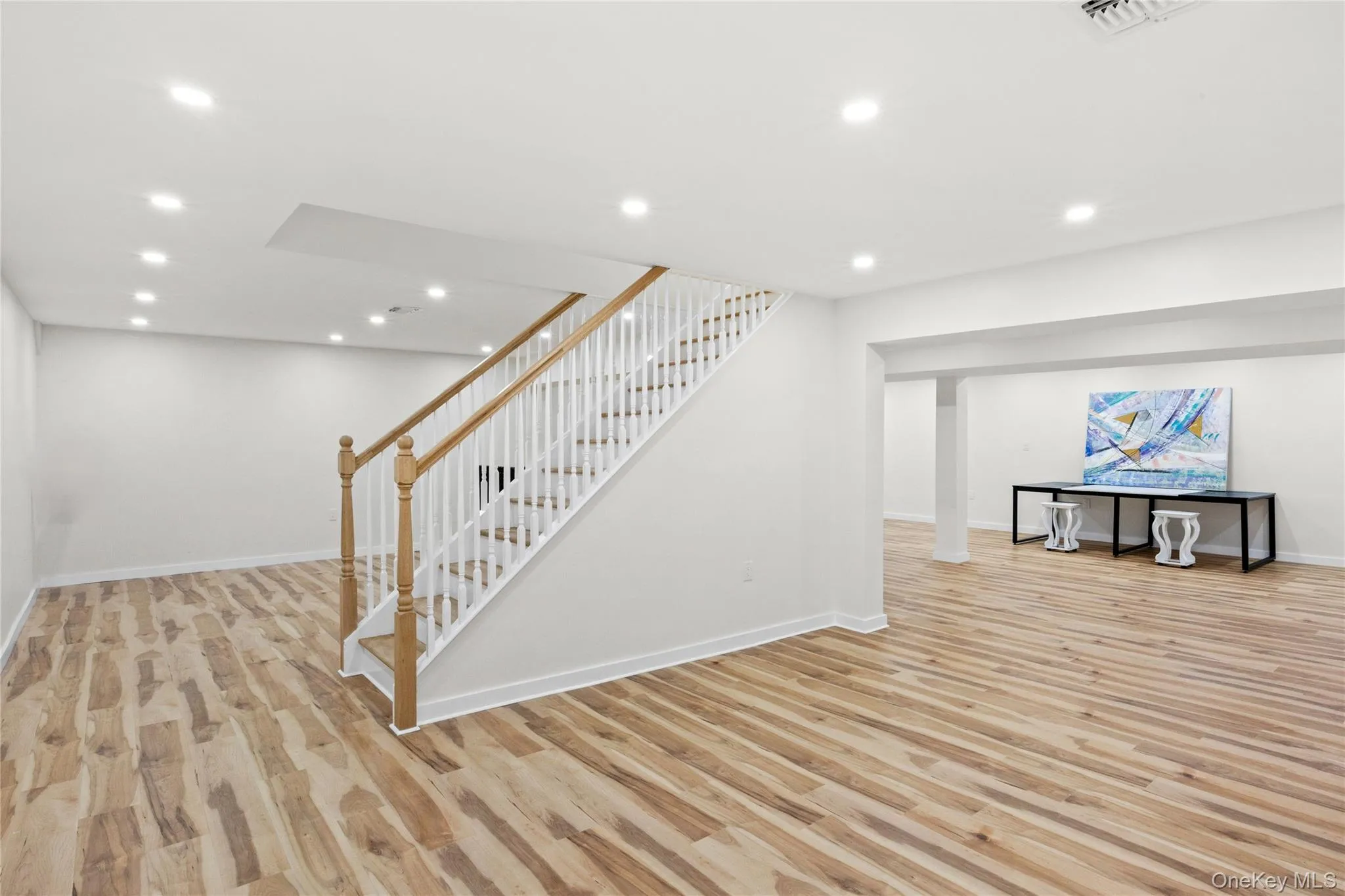 Big basement with 4 oversized egress windows wood floor look luxury vinyl Big basement with 4 oversized egress windows wood floor look luxury vinyl