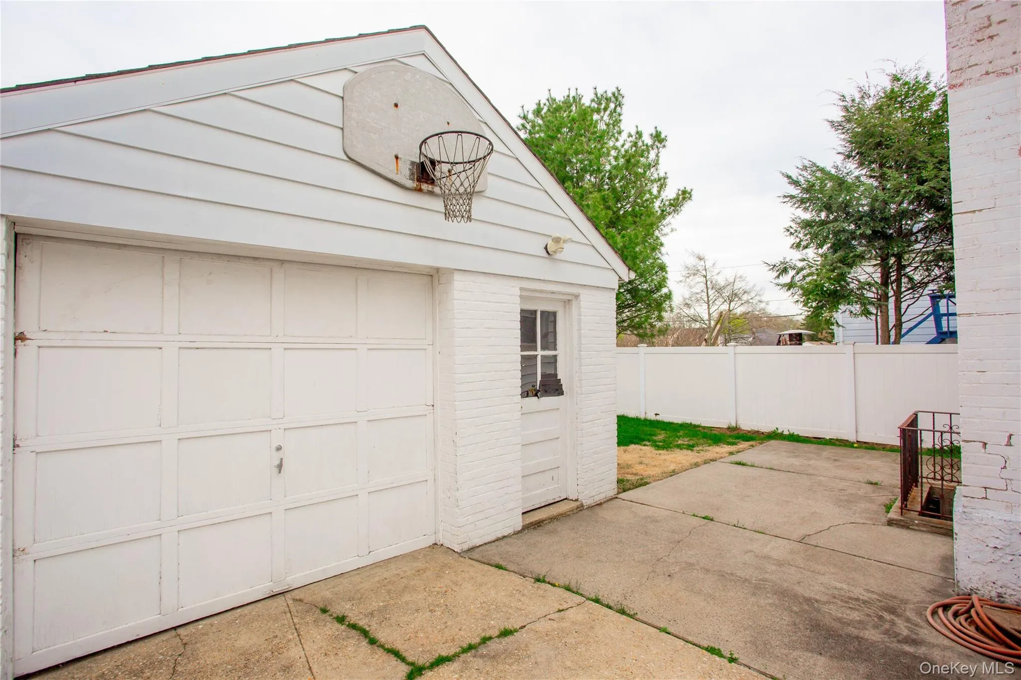 Garage featuring fence Garage featuring fence