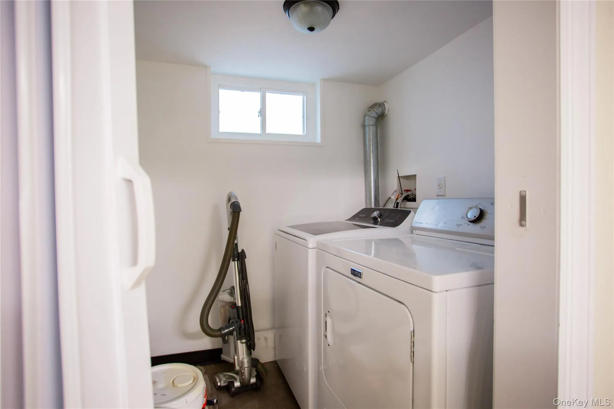 Laundry area with washing machine and dryer and laundry area Laundry area with washing machine and dryer and laundry area