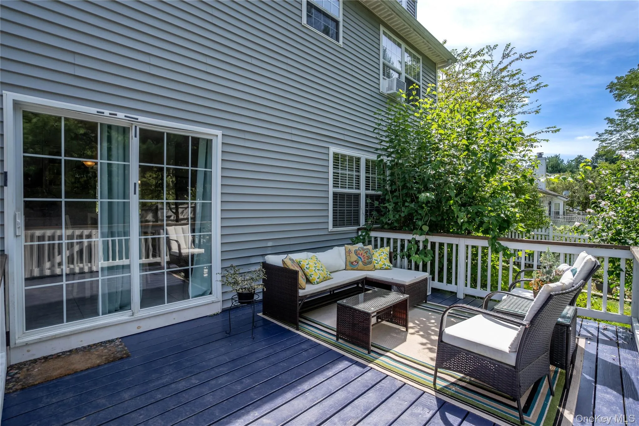 Wooden deck with an outdoor hangout area Wooden deck with an outdoor hangout area