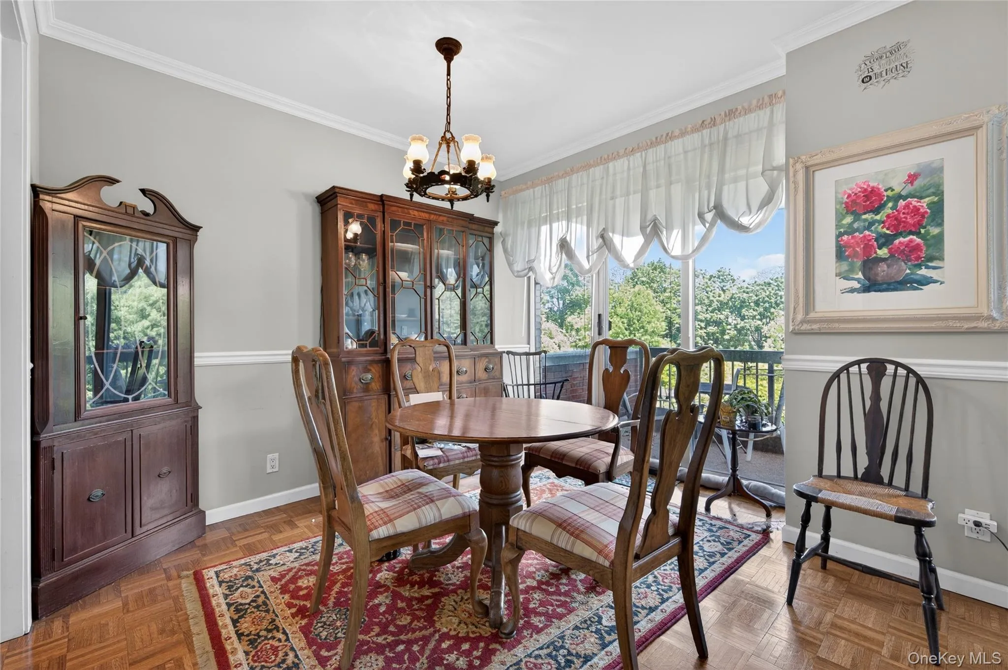 Dining area featuring hardwood parquet flooring and sliding door to balcony Dining area featuring hardwood parquet flooring and sliding door to balcony