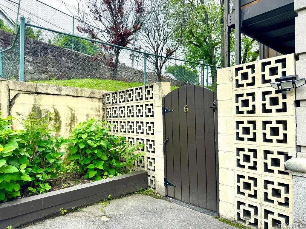 Private entrance from outside of building into patio Private entrance from outside of building into patio